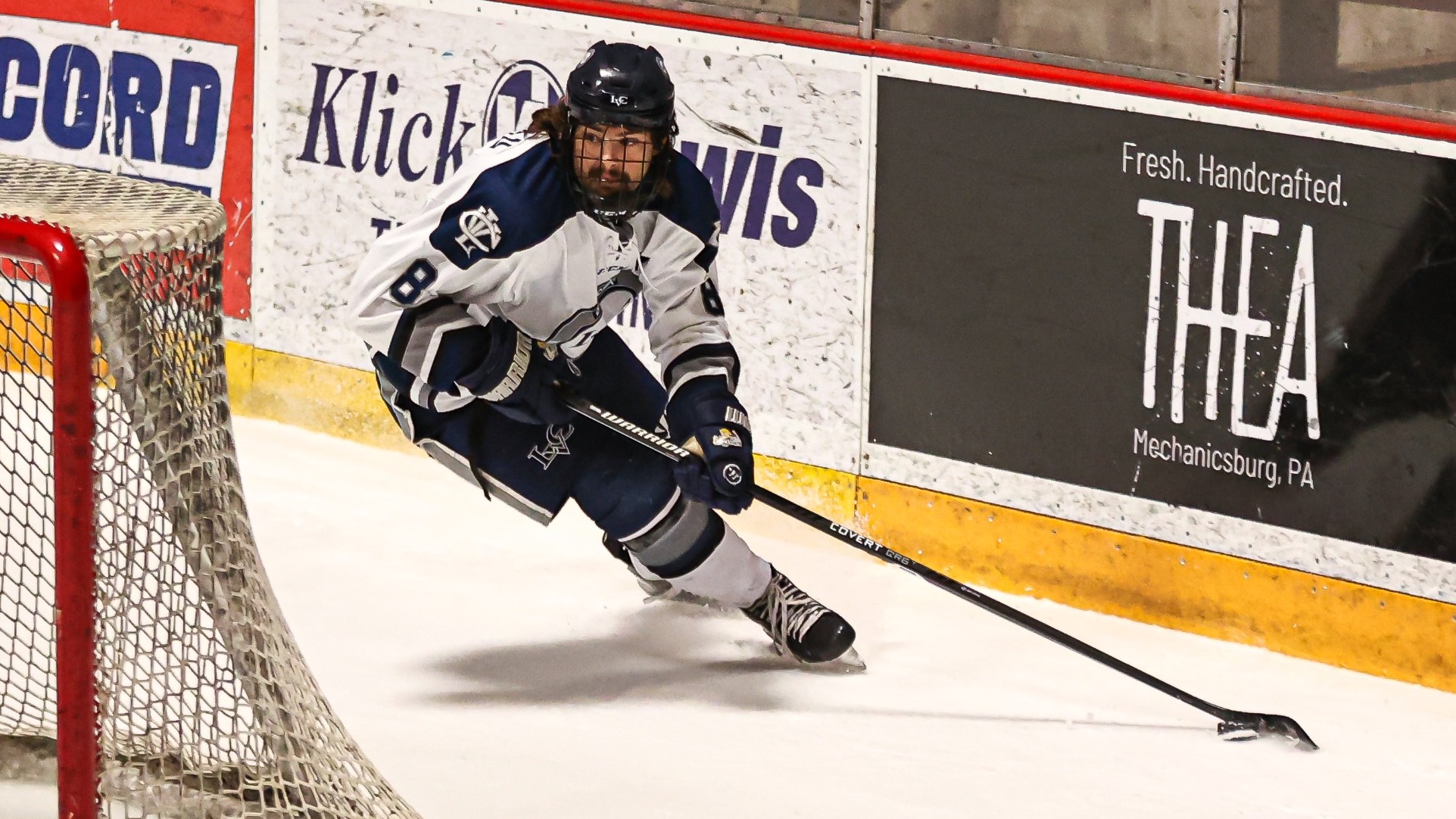 Cameron Croteau skates around the net with the puck