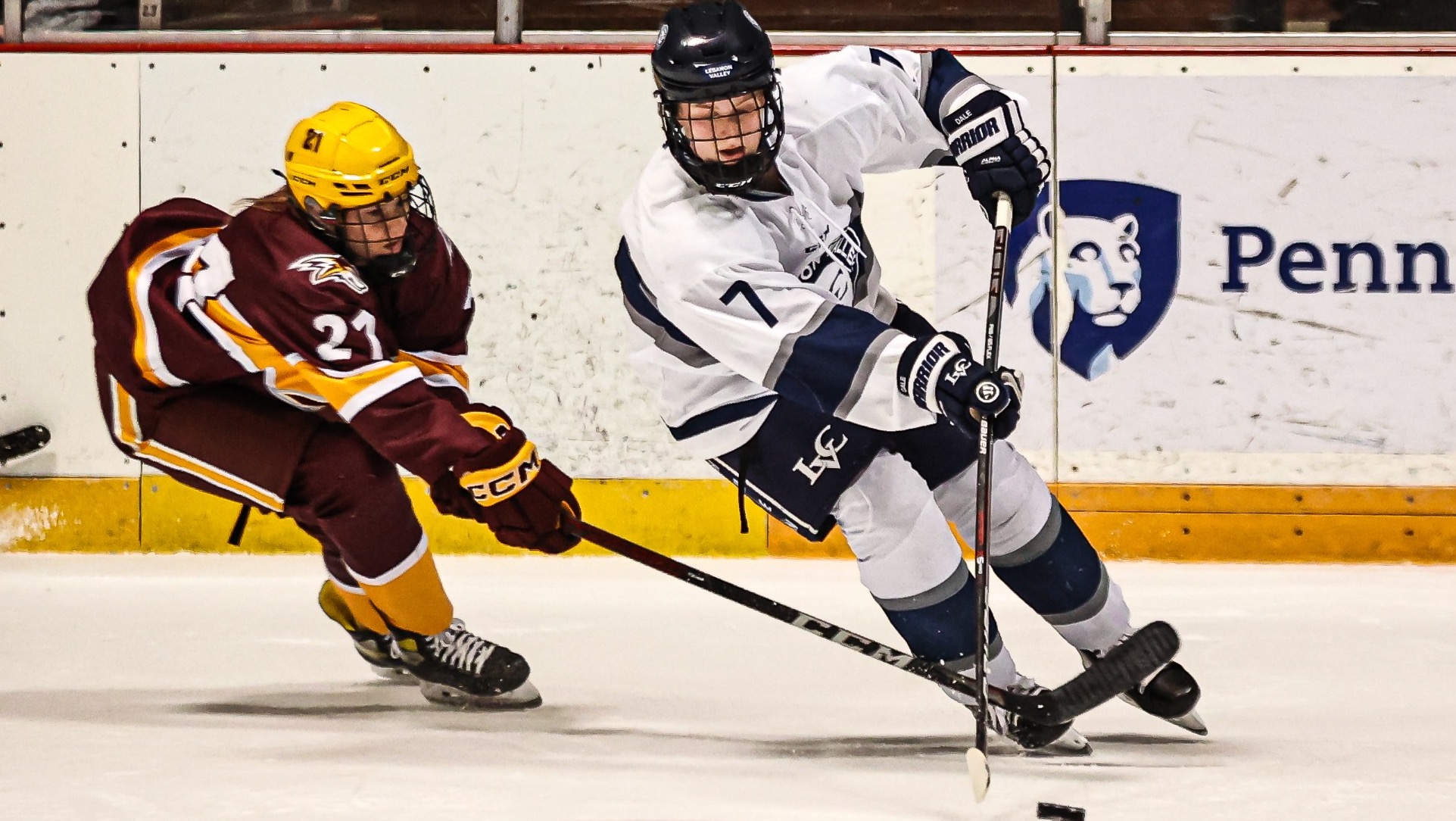 Anna Dale takes the puck past a defender