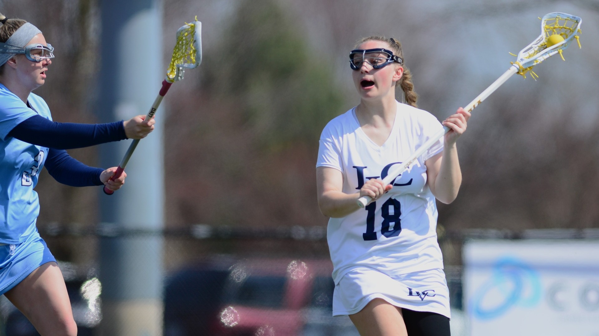 Elizabeth Morgan running around defender