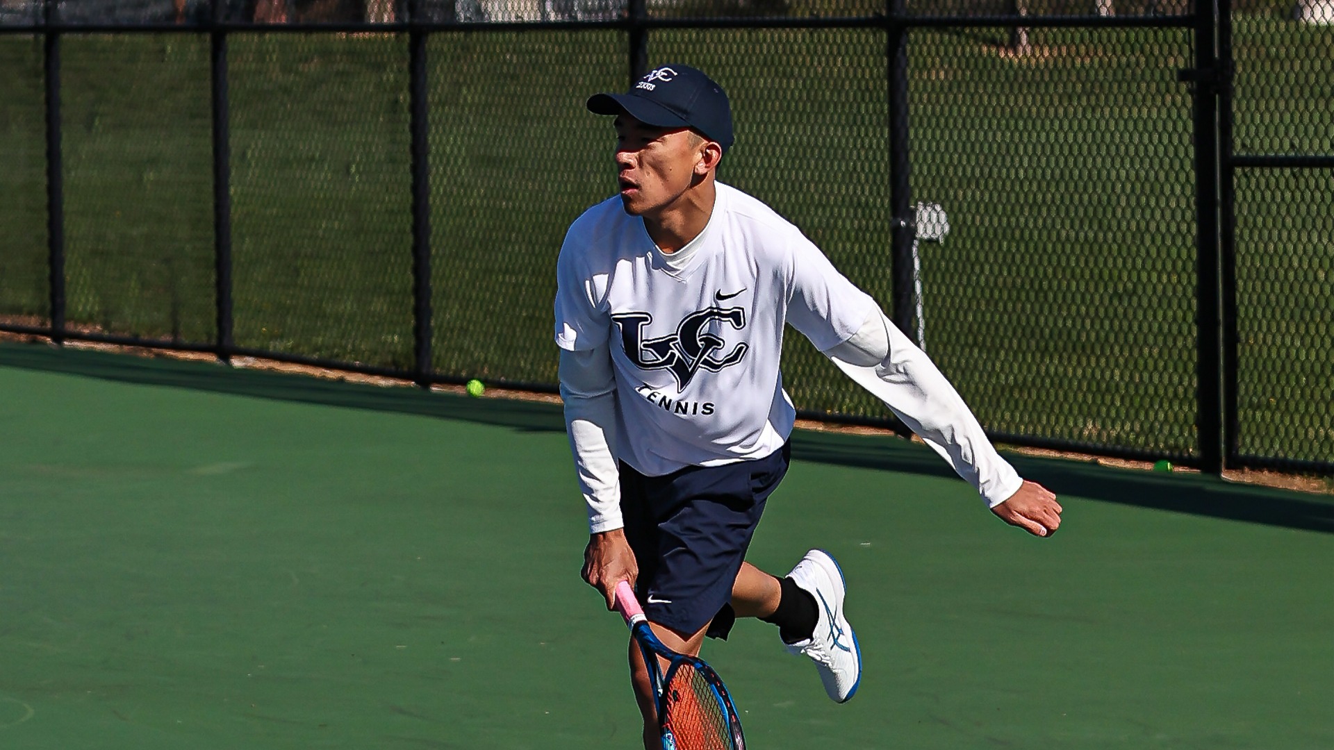 Ethan Luu follow through on serve
