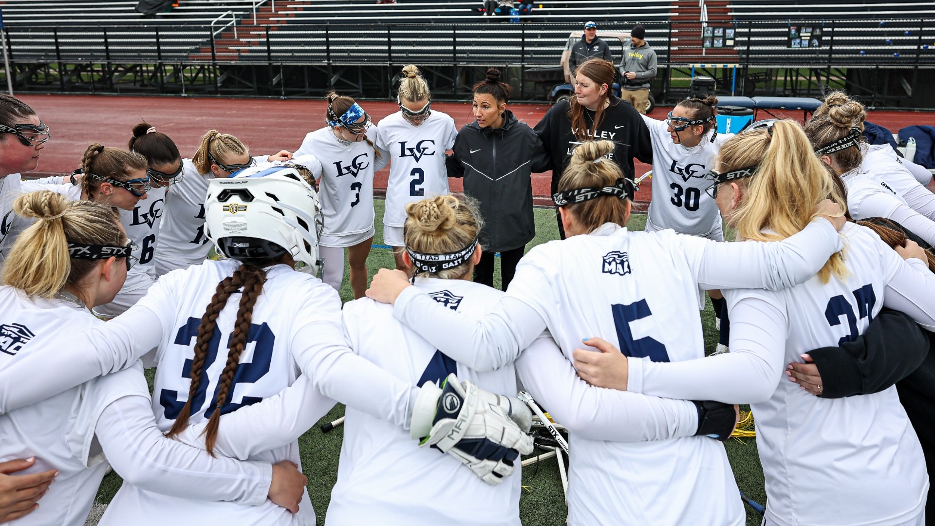 Women's Lacrosse team huddle 2025