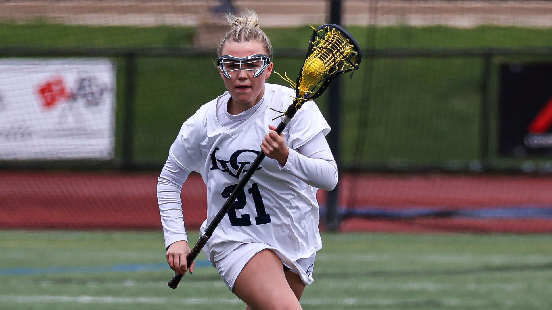 Chloe Moser running ball down the field