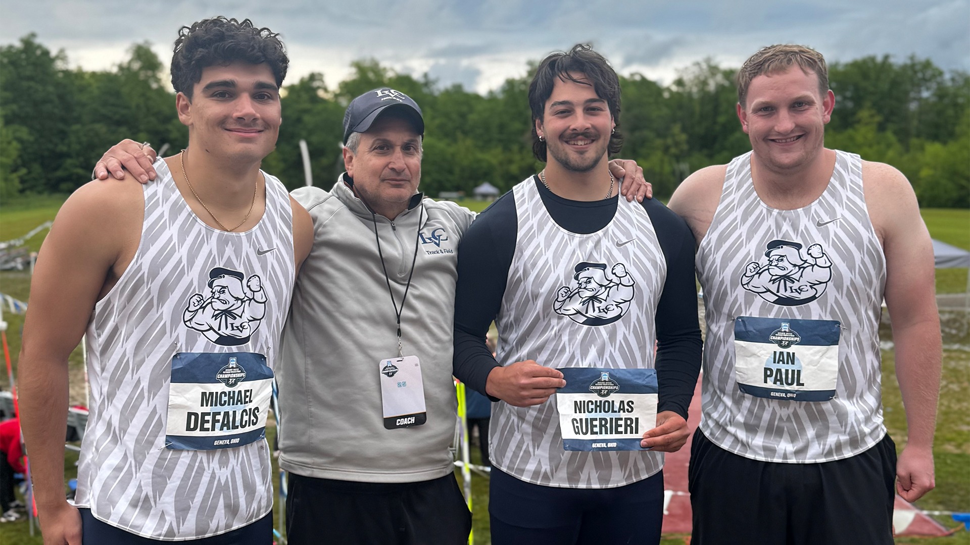 Javelin throwers with coach at NCAA Championships