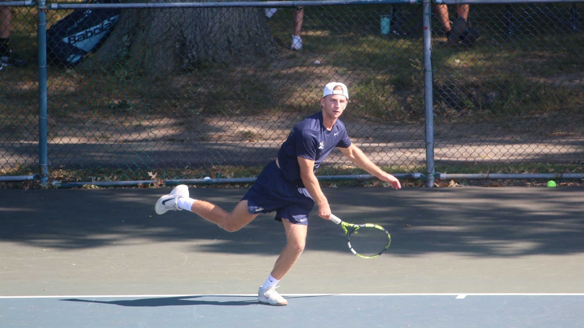 Mason Dissinger hitting serve