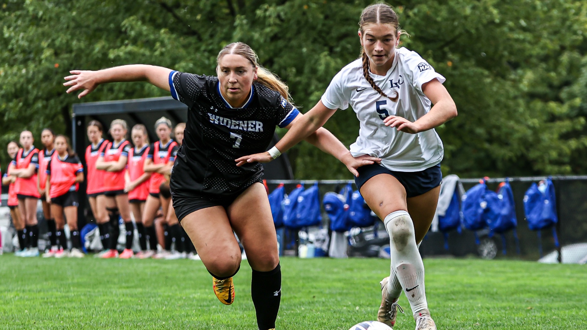 Abrielle Miller competes with a defender for the ball