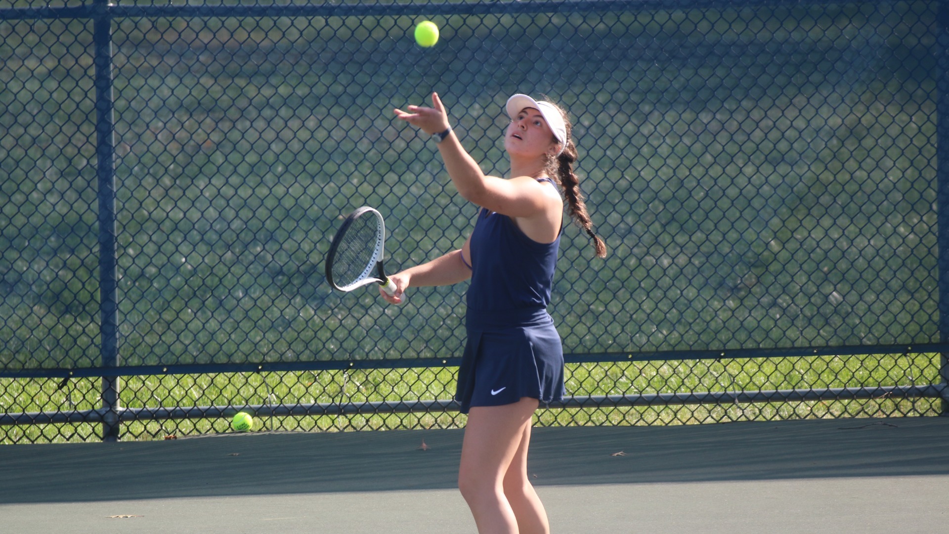 Erika Badner tossing up serve