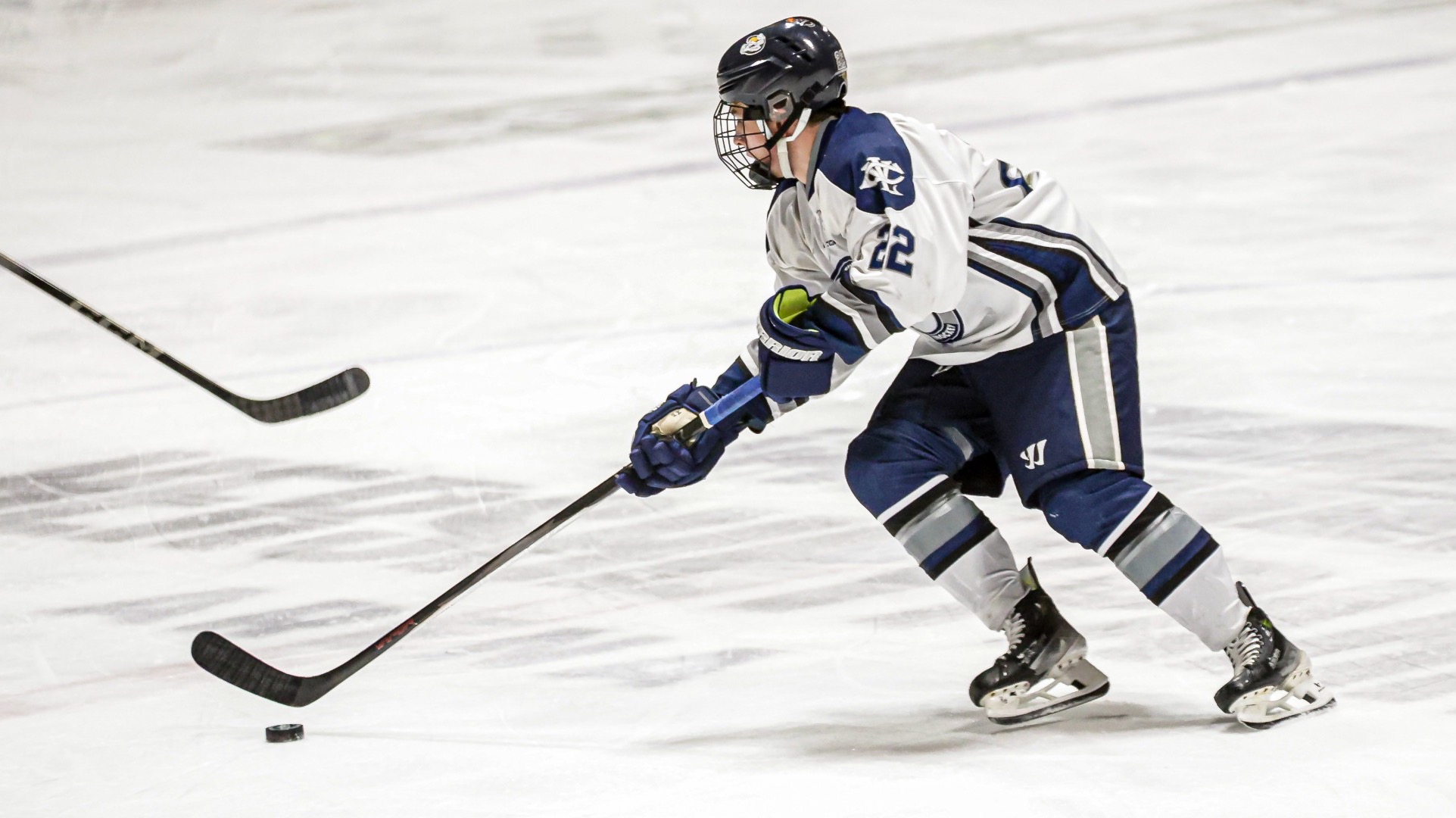 Owen Ames brings the puck up the ice