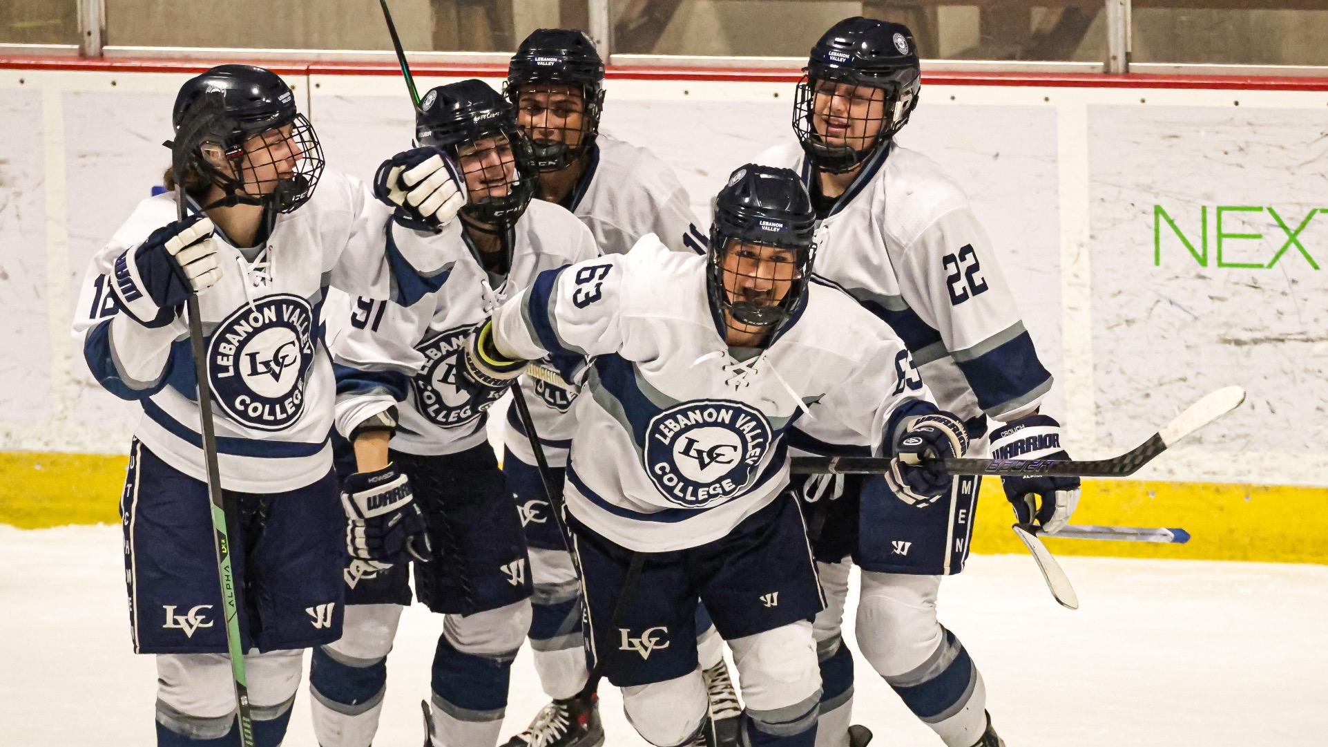 Women's Ice Hockey celebrates a goal