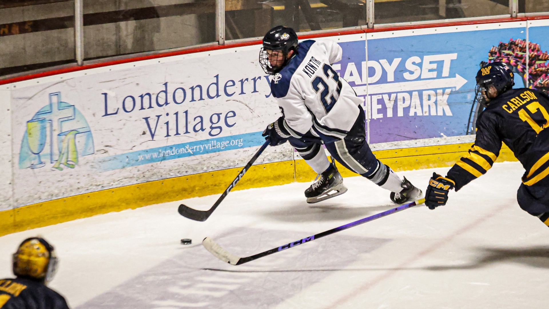 Max Kontir takes the puck away from a defenseman