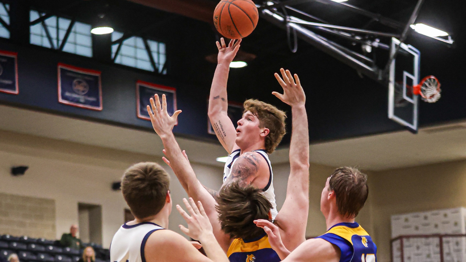 Michael Main rising above defenders for a shot