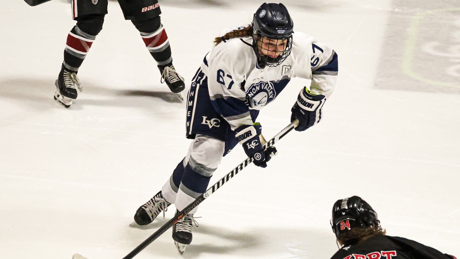 Tiffany Anderson skates toward the puck