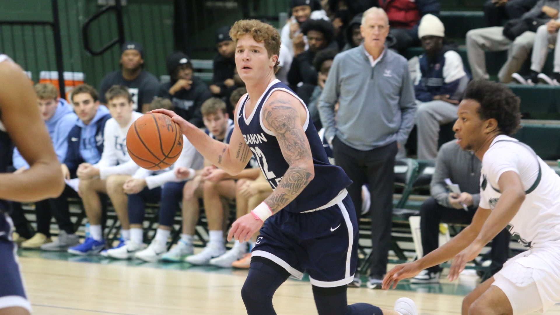 Michael Main dribbling around defende