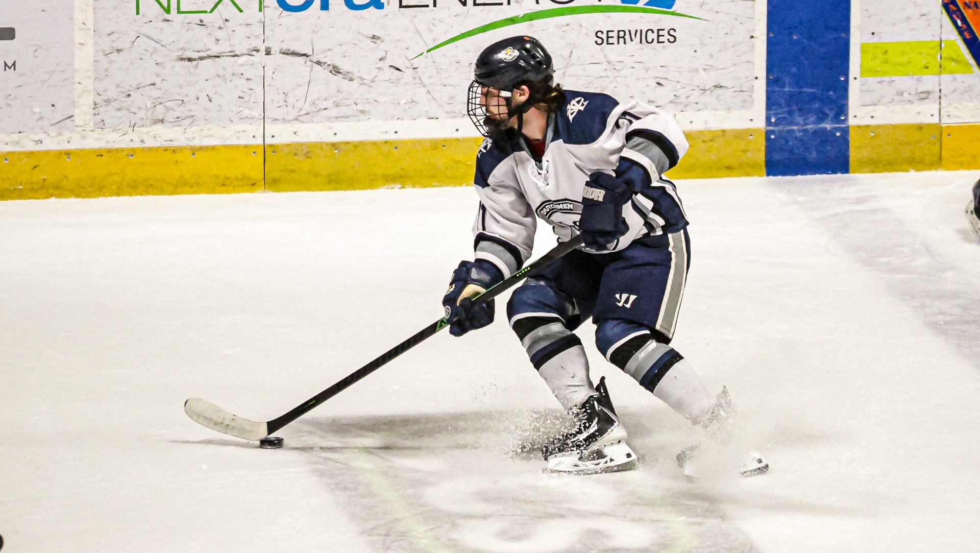 John King brings the puck toward the net