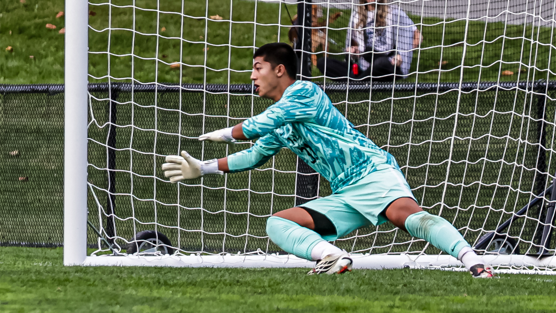 Isaac Yerger dives toward the ball for a save