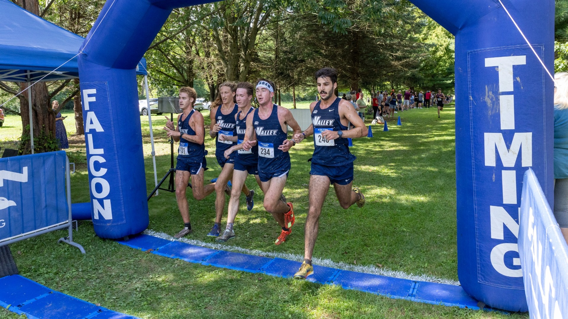 Men's team crossing finish line