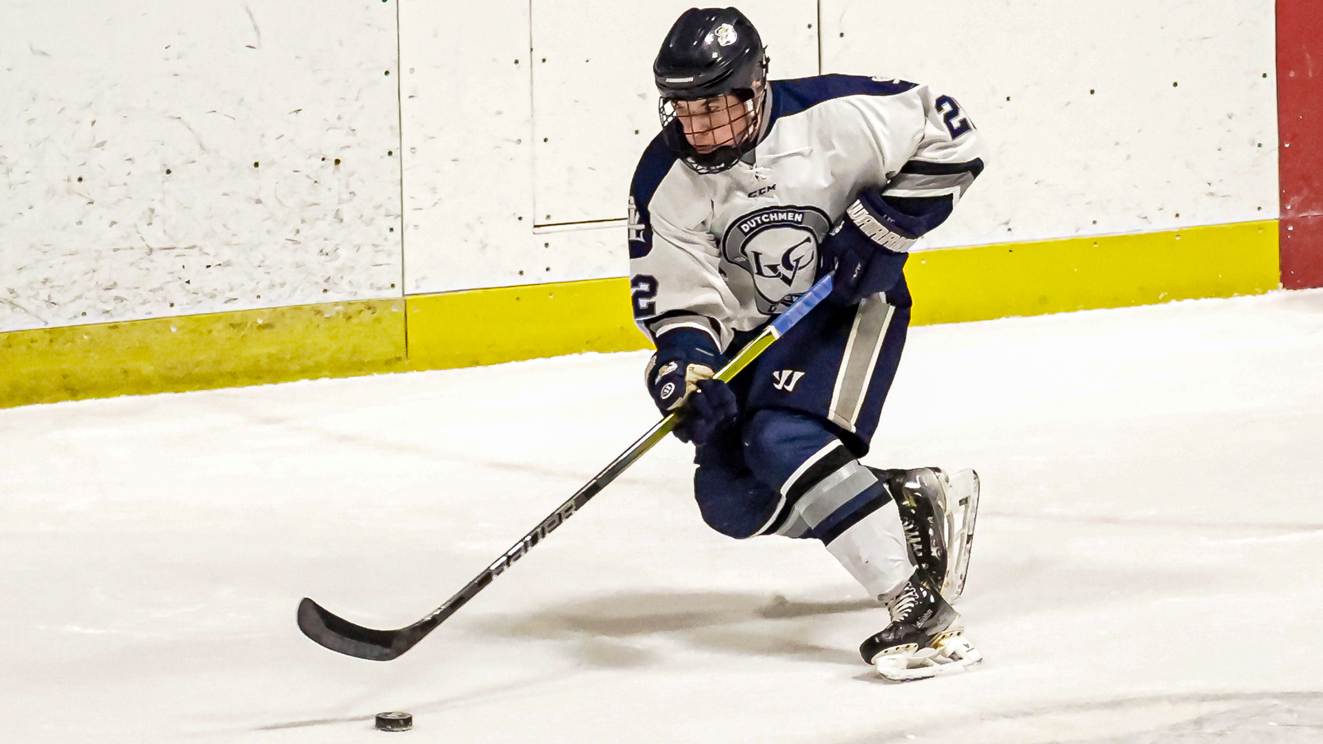 Owen Ames preparing to pass the puck