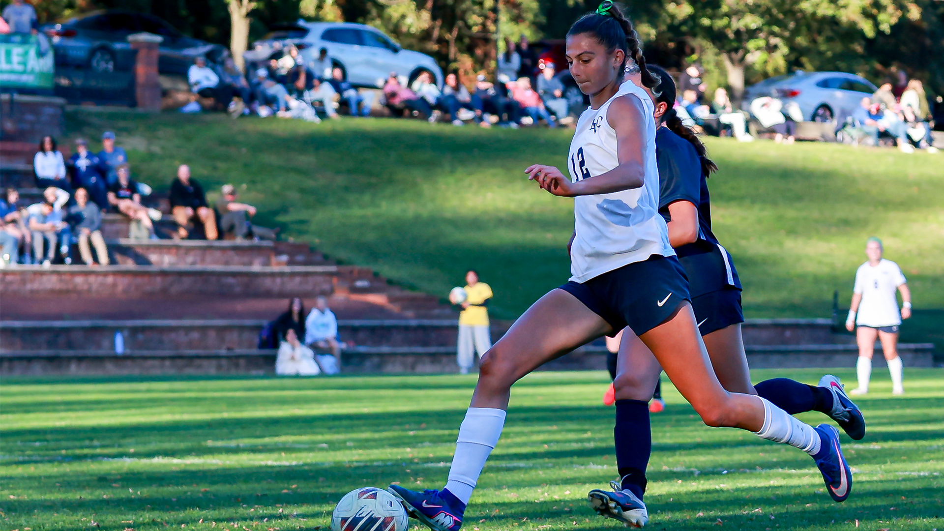 Ashlynn Newton takes the ball toward the net