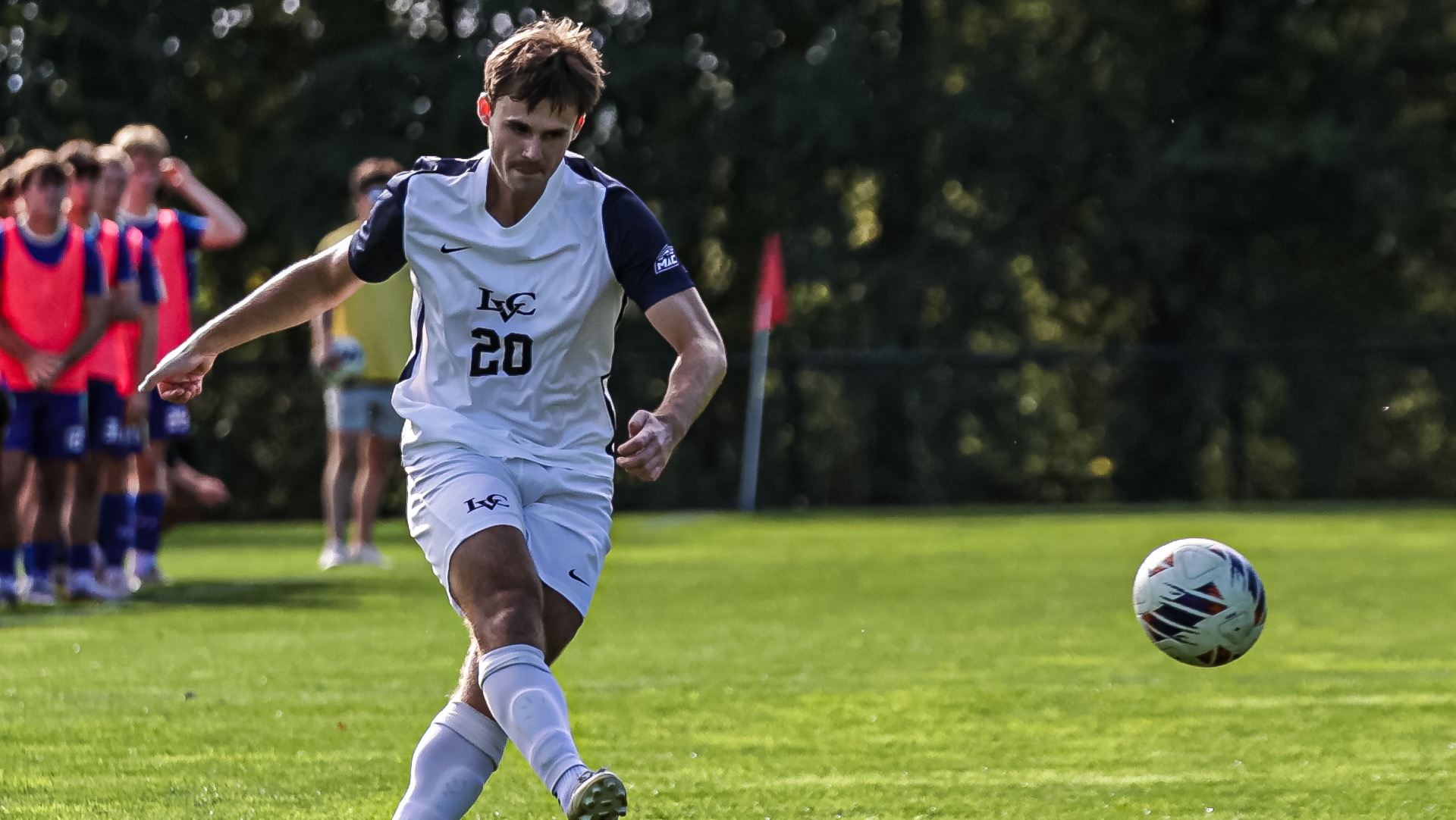 Logan Hicks kicks the ball toward the net