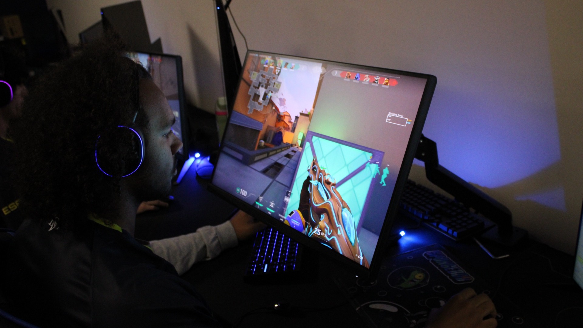 Esports image of player watching game on computer screen