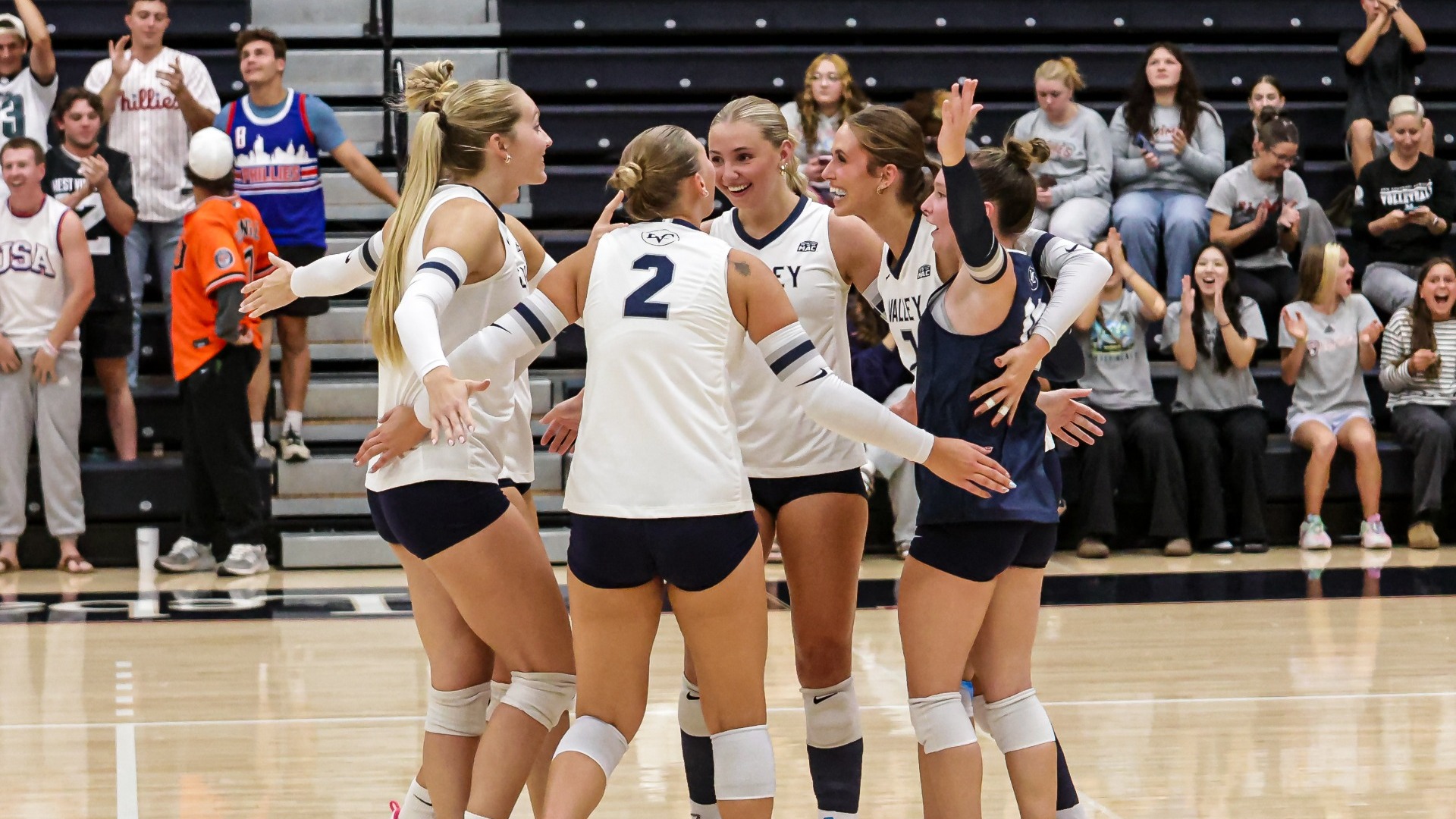 Women's Volleyball team celebrating point
