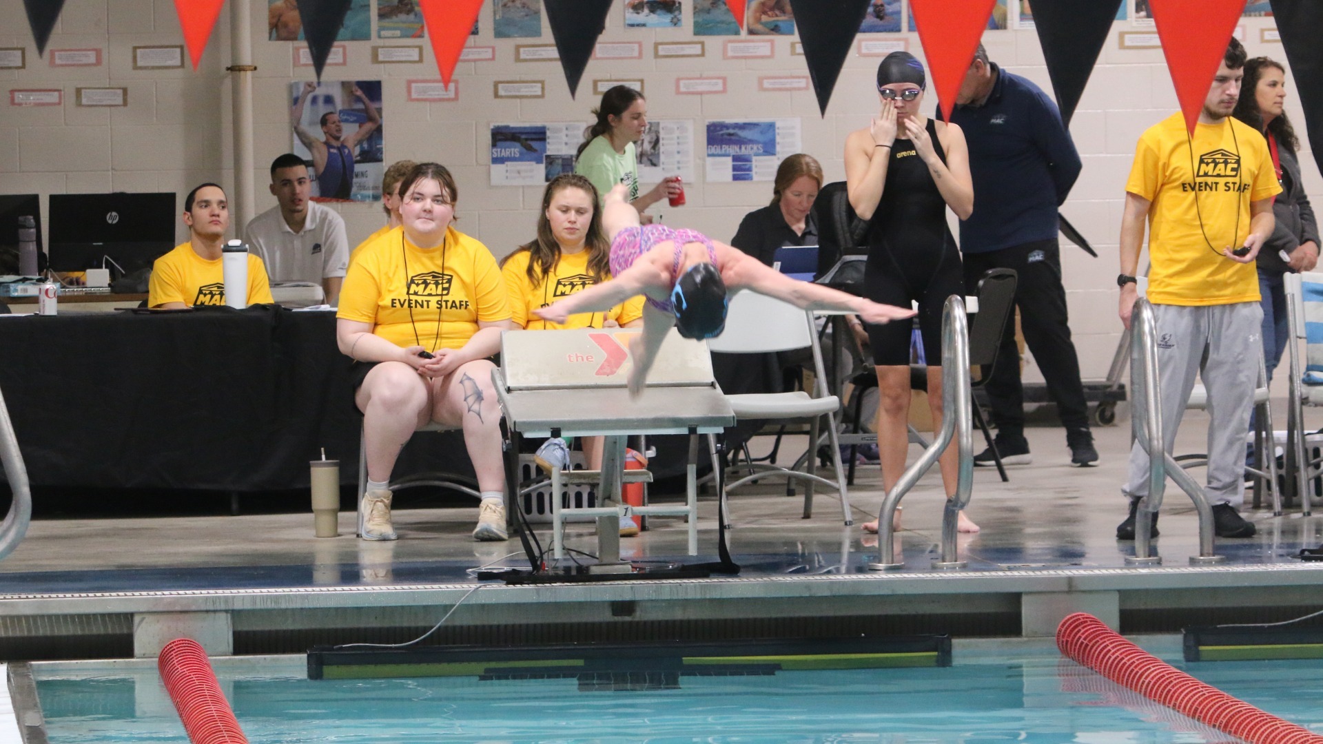 Noryan Mitchell jumping off blocks