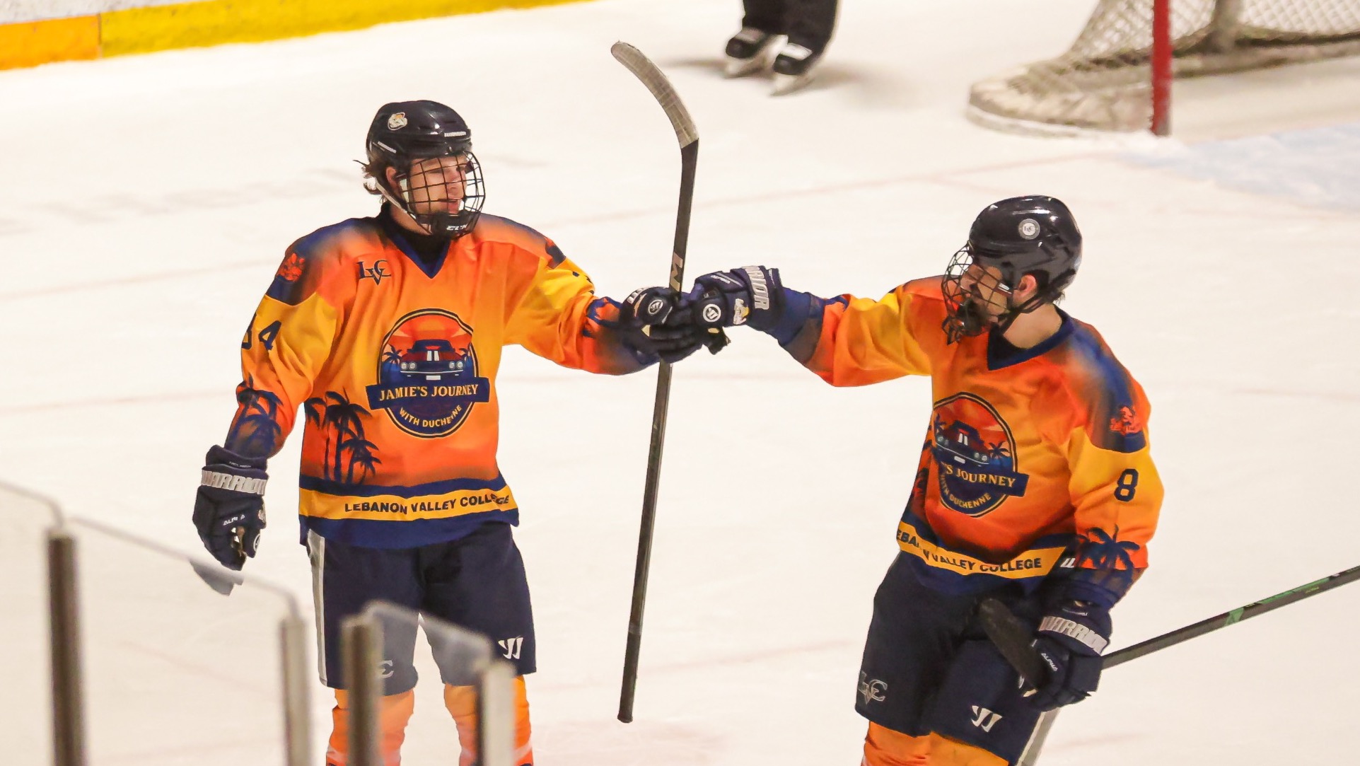 Cade Helmer and Cameron Croteau celebrate a goal