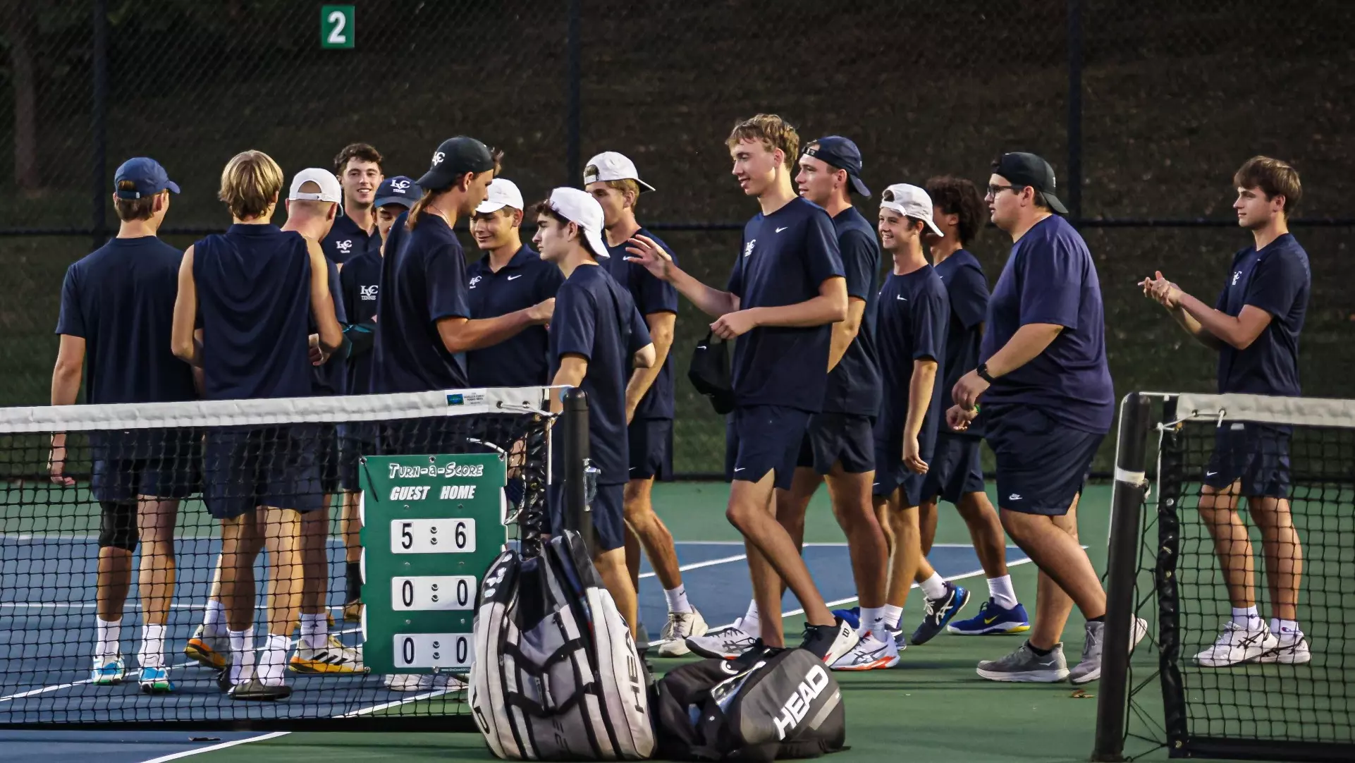 2025-26 Men's Tennis team celebrating a win