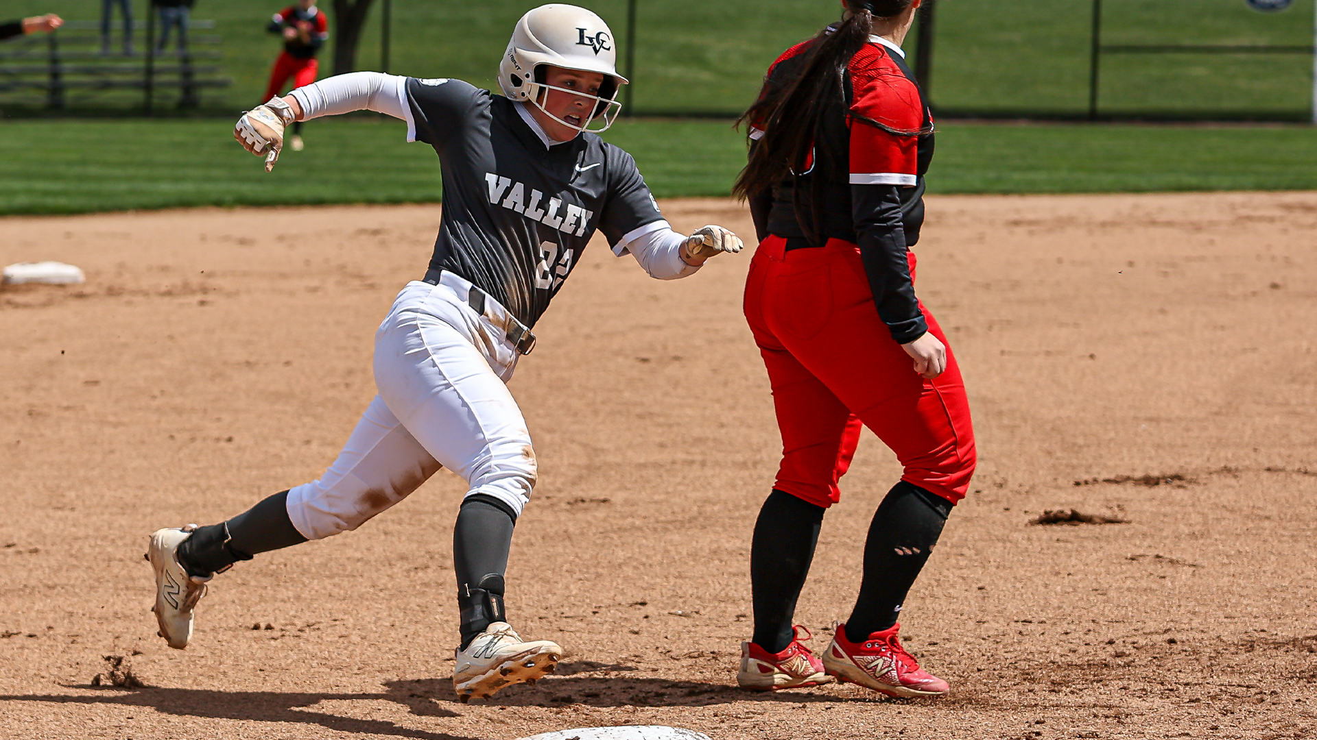 Megan Heard rounding third base