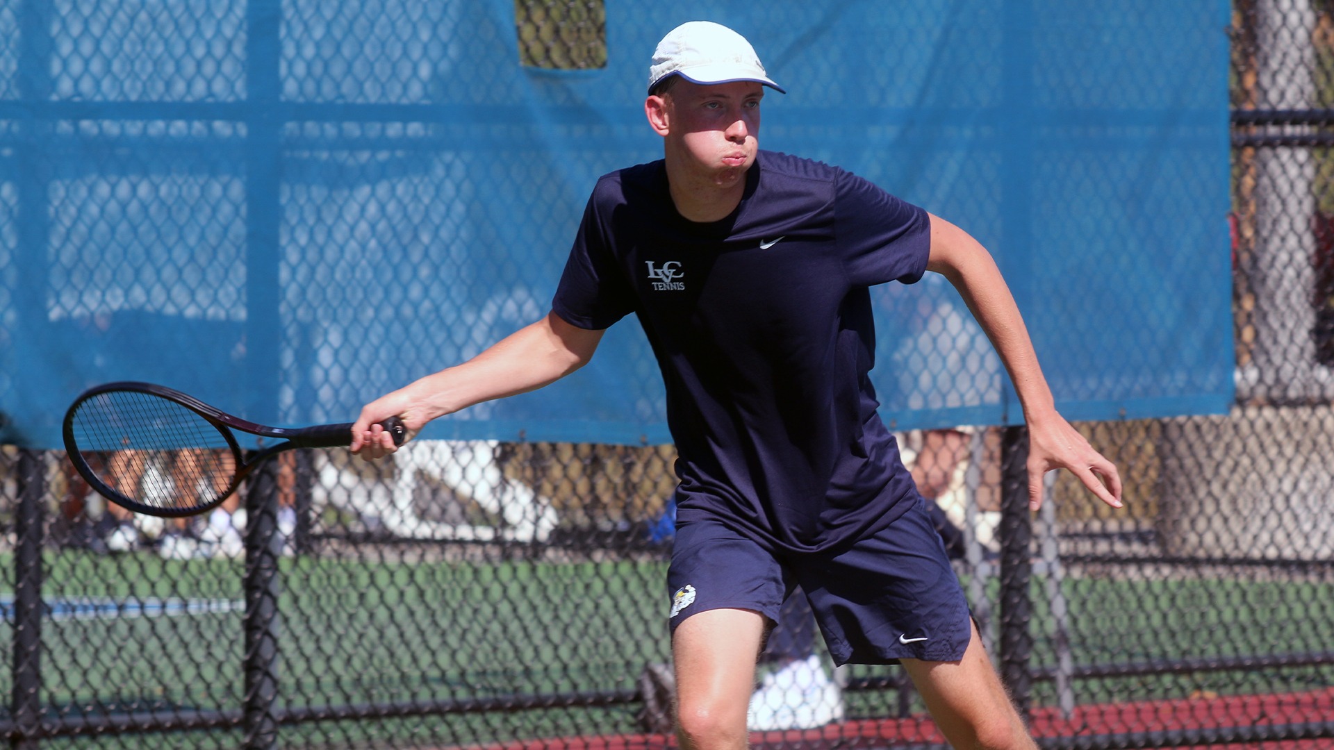 Colin Brusse hitting return shot