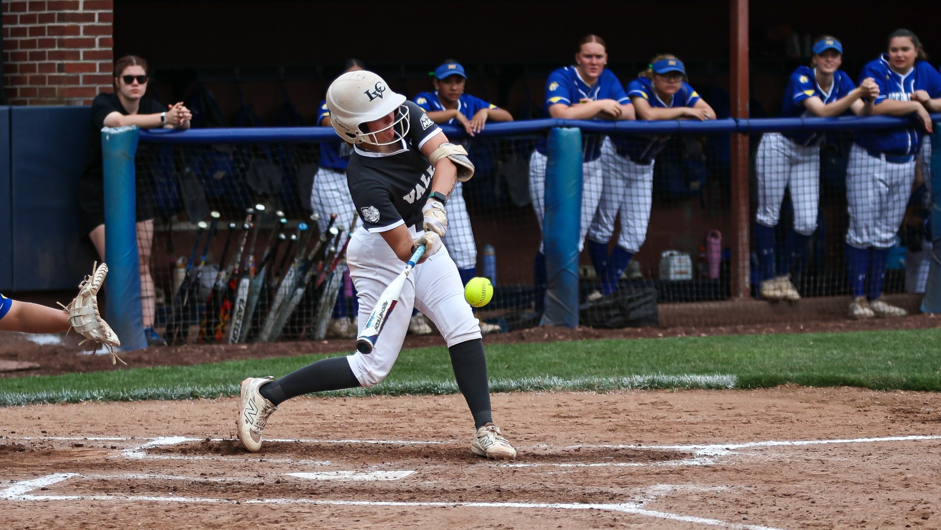 Maddy Gronback swinging the bat