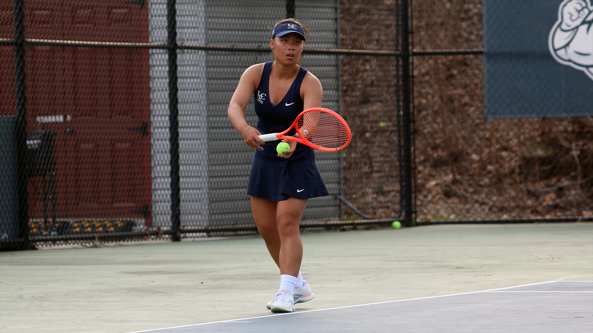 Catherine Stone serving the ball