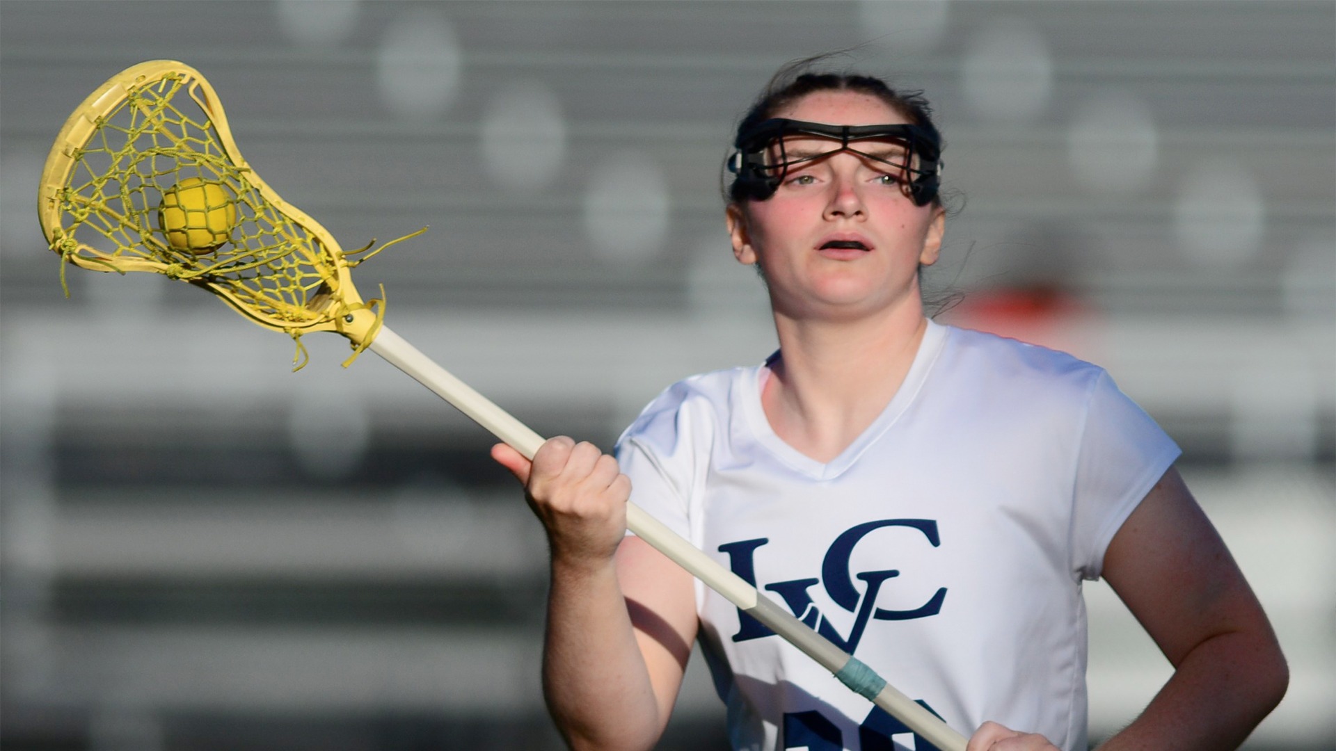 Katie DeWitt with ball in stick