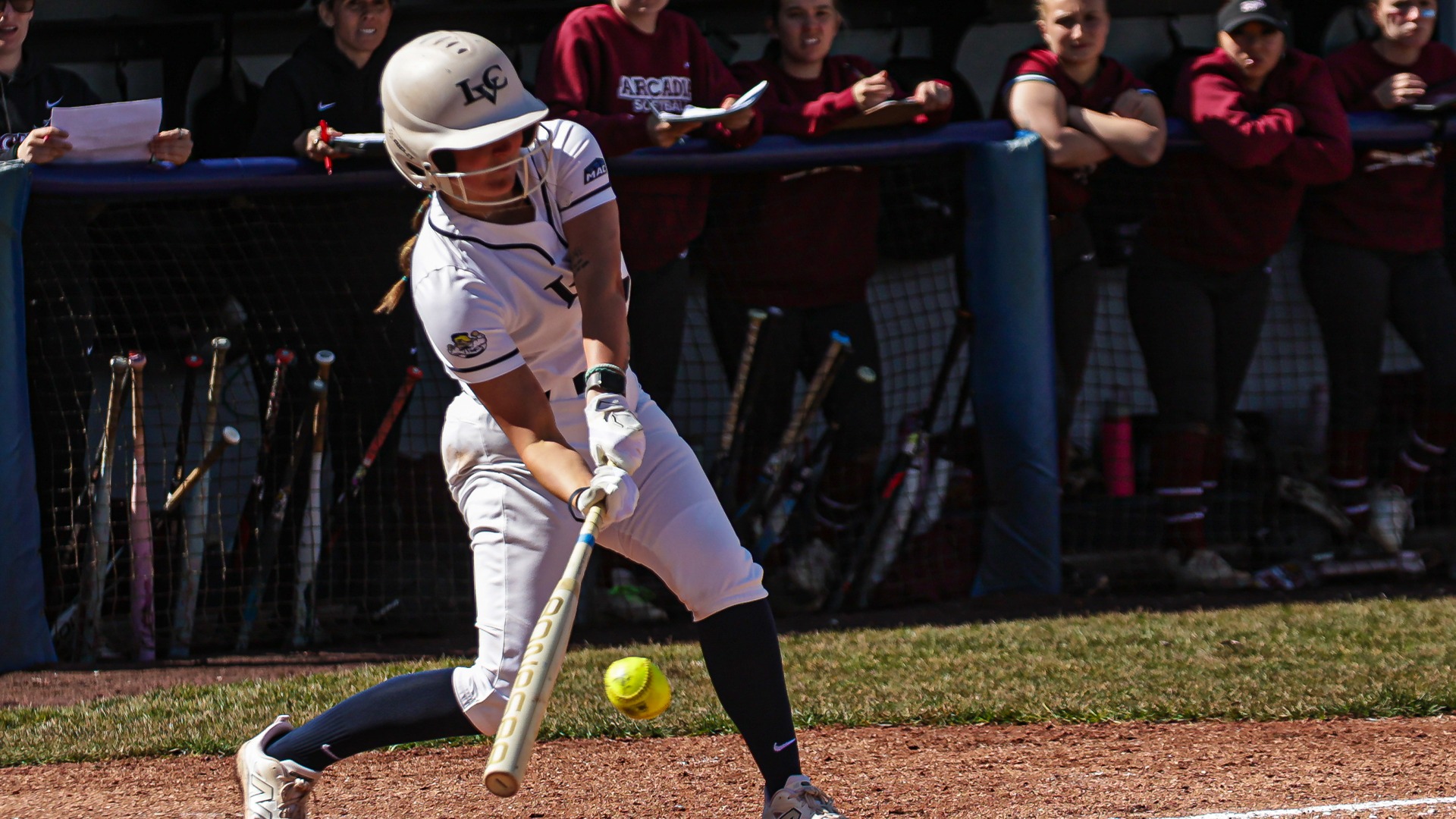 Maddy Gronback hitting a pitch