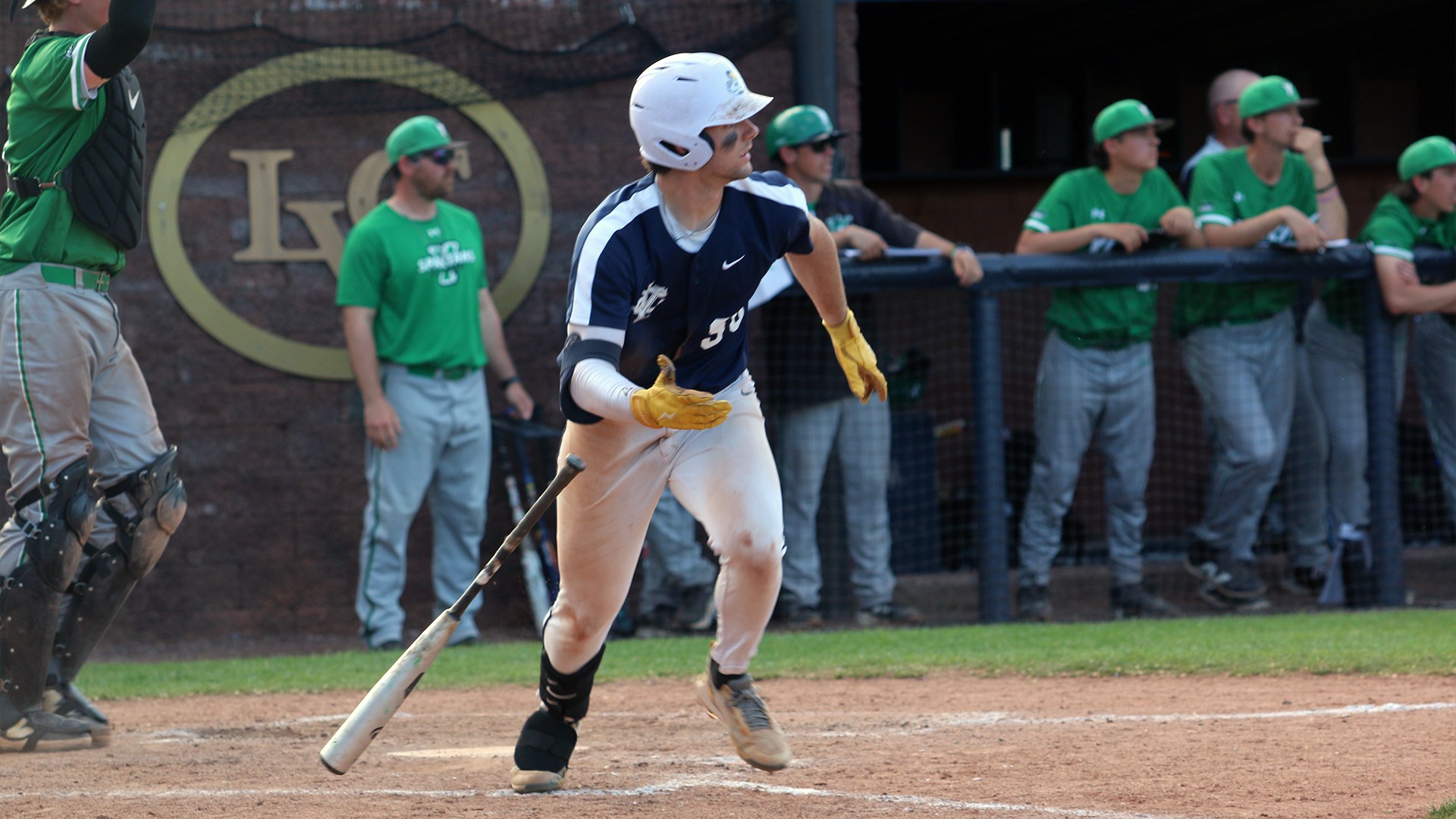Lucien Burger running down baseline after hit