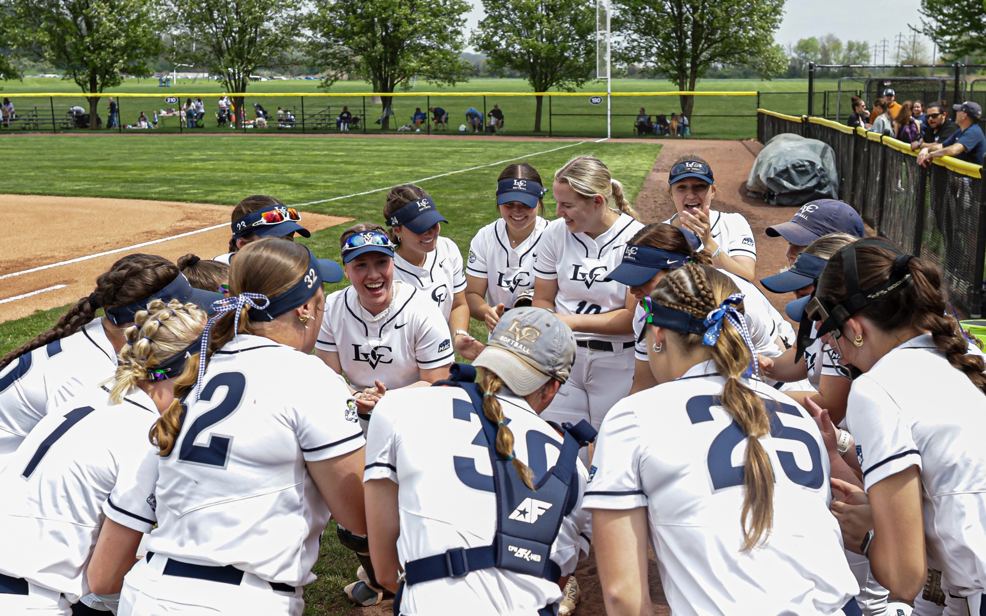 Softball Senior Day 2026 team huddle