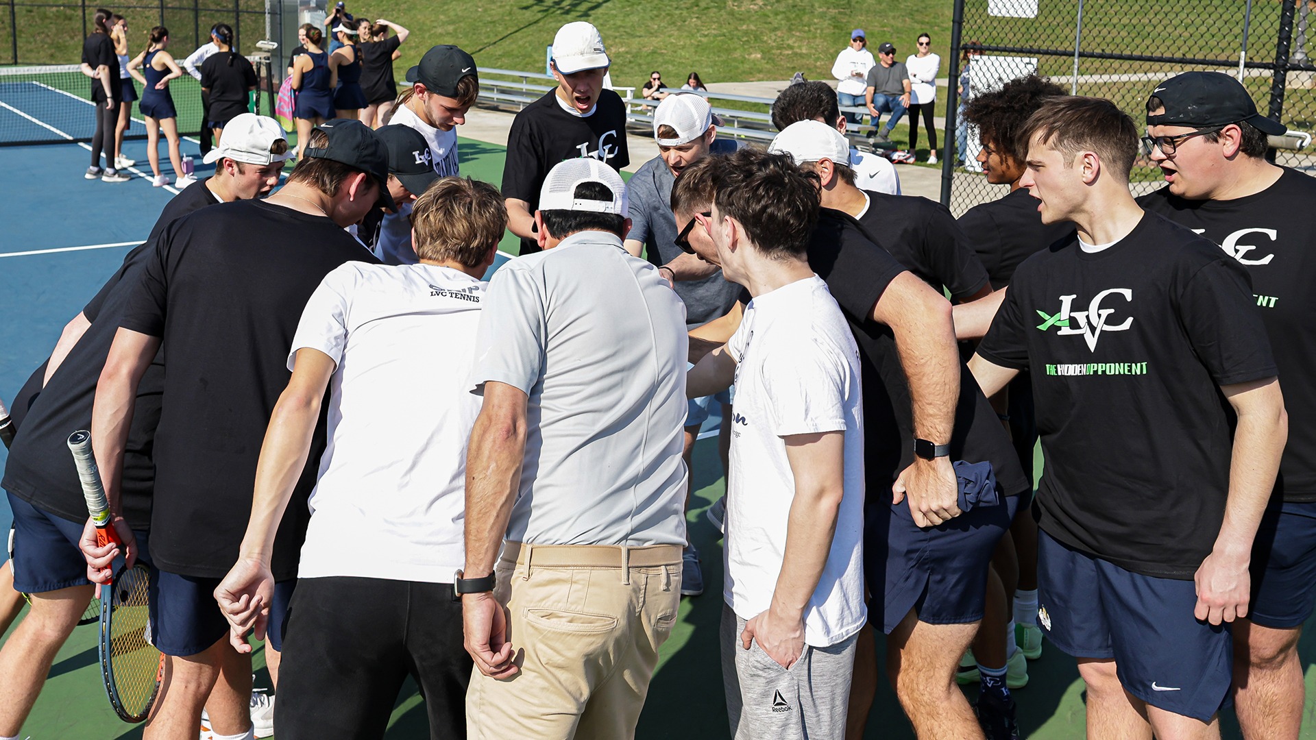 Men's tennis team huddle pre-match cheer