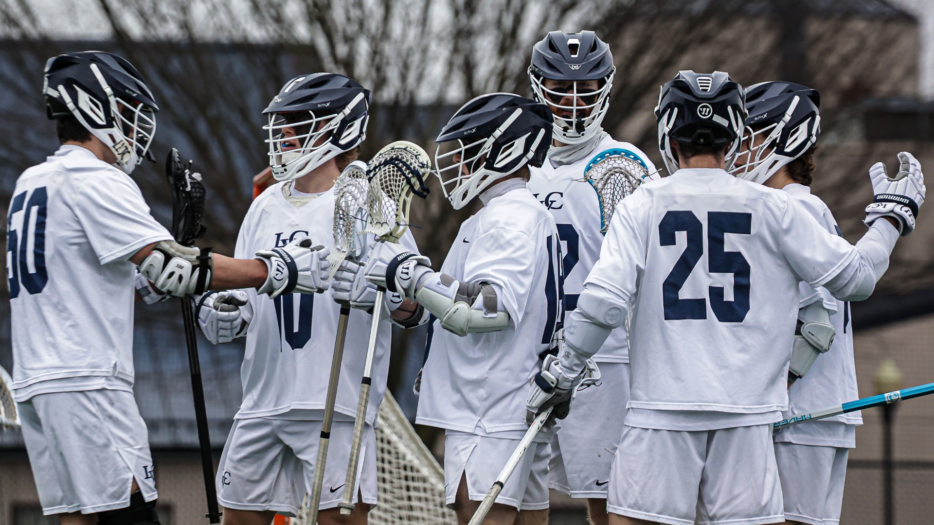 Men's Lacrosse celebrating a goal
