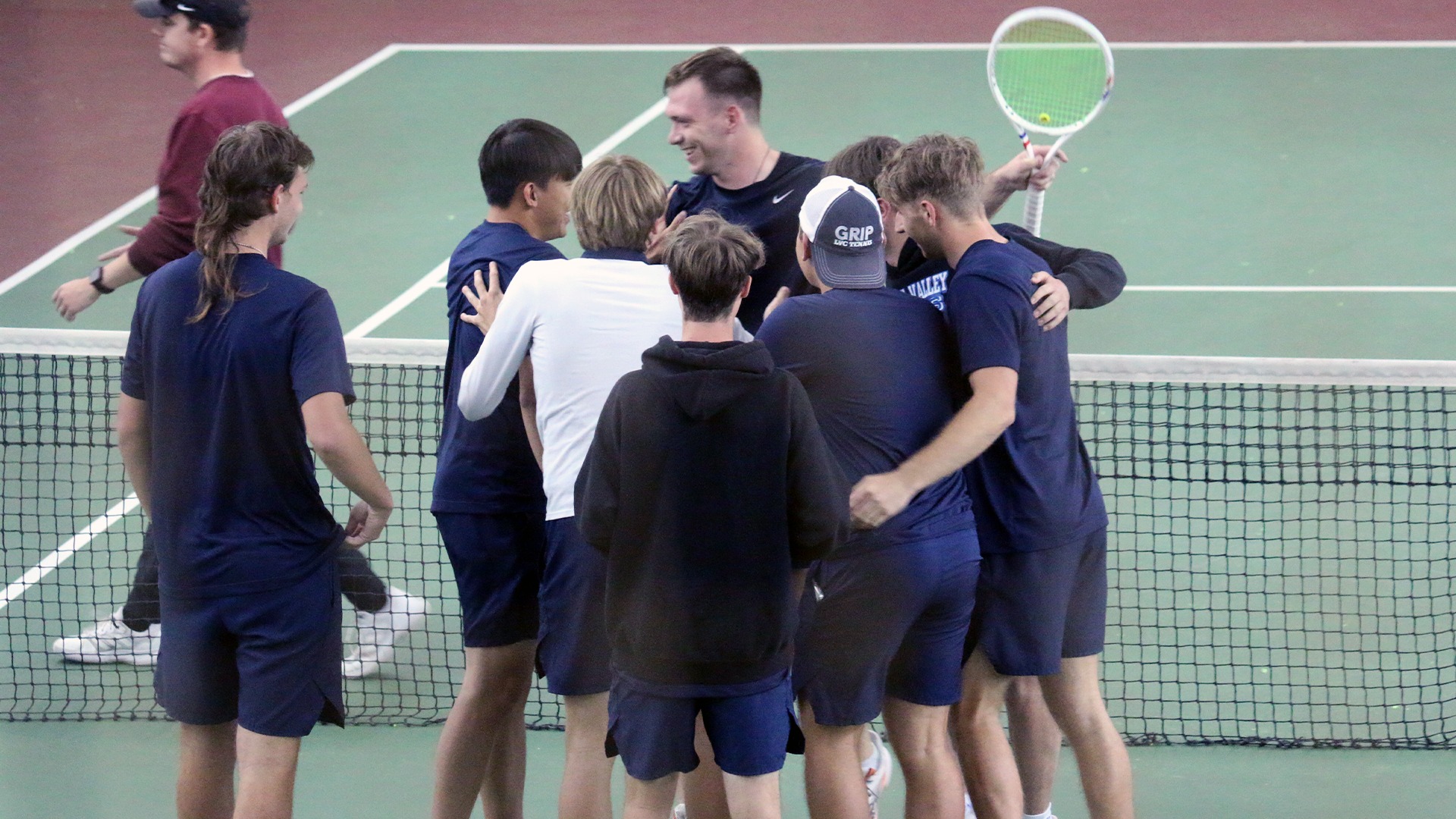 Men's Tennis clinching celebration