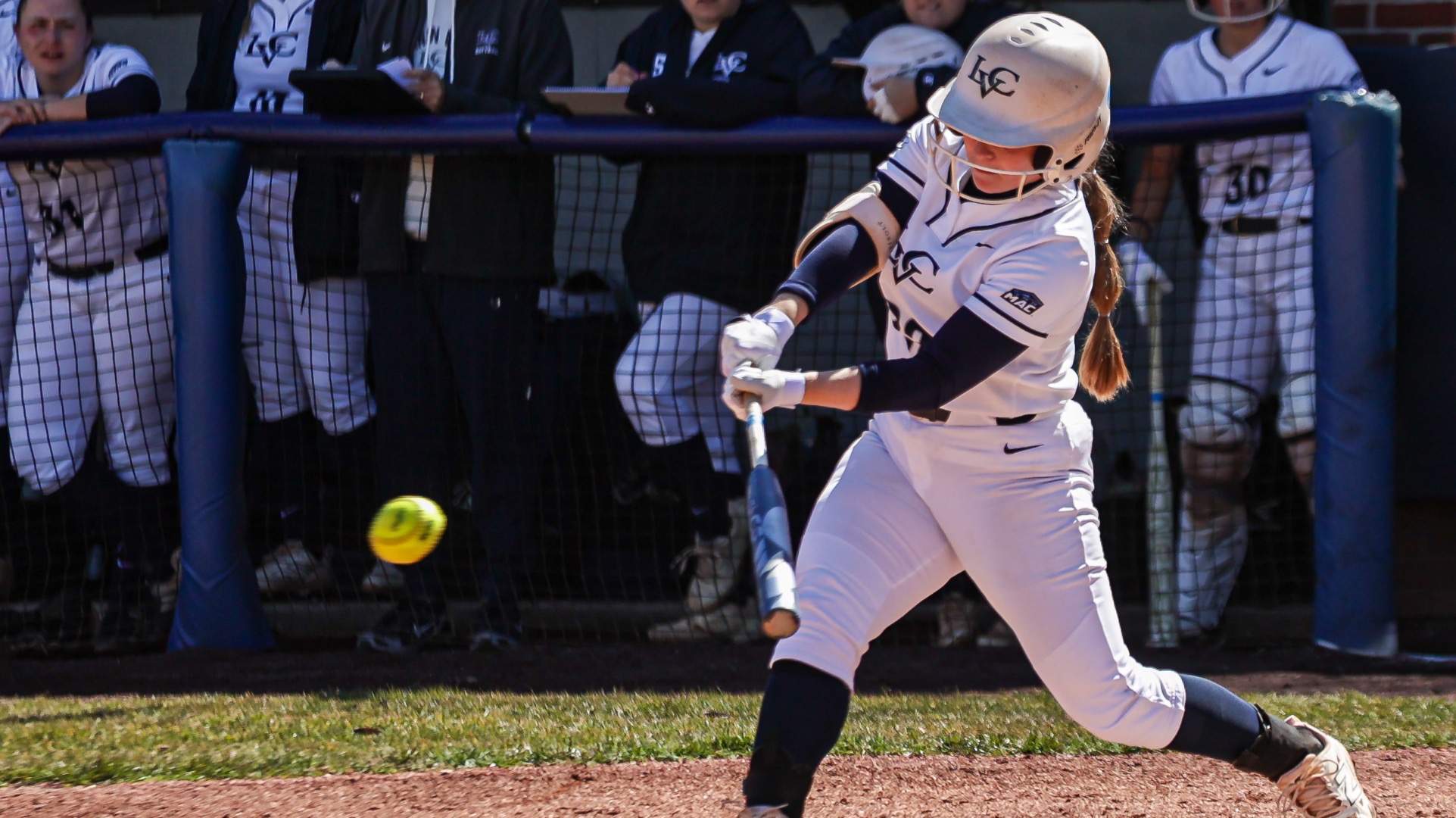 Megan Heard hitting a pitch