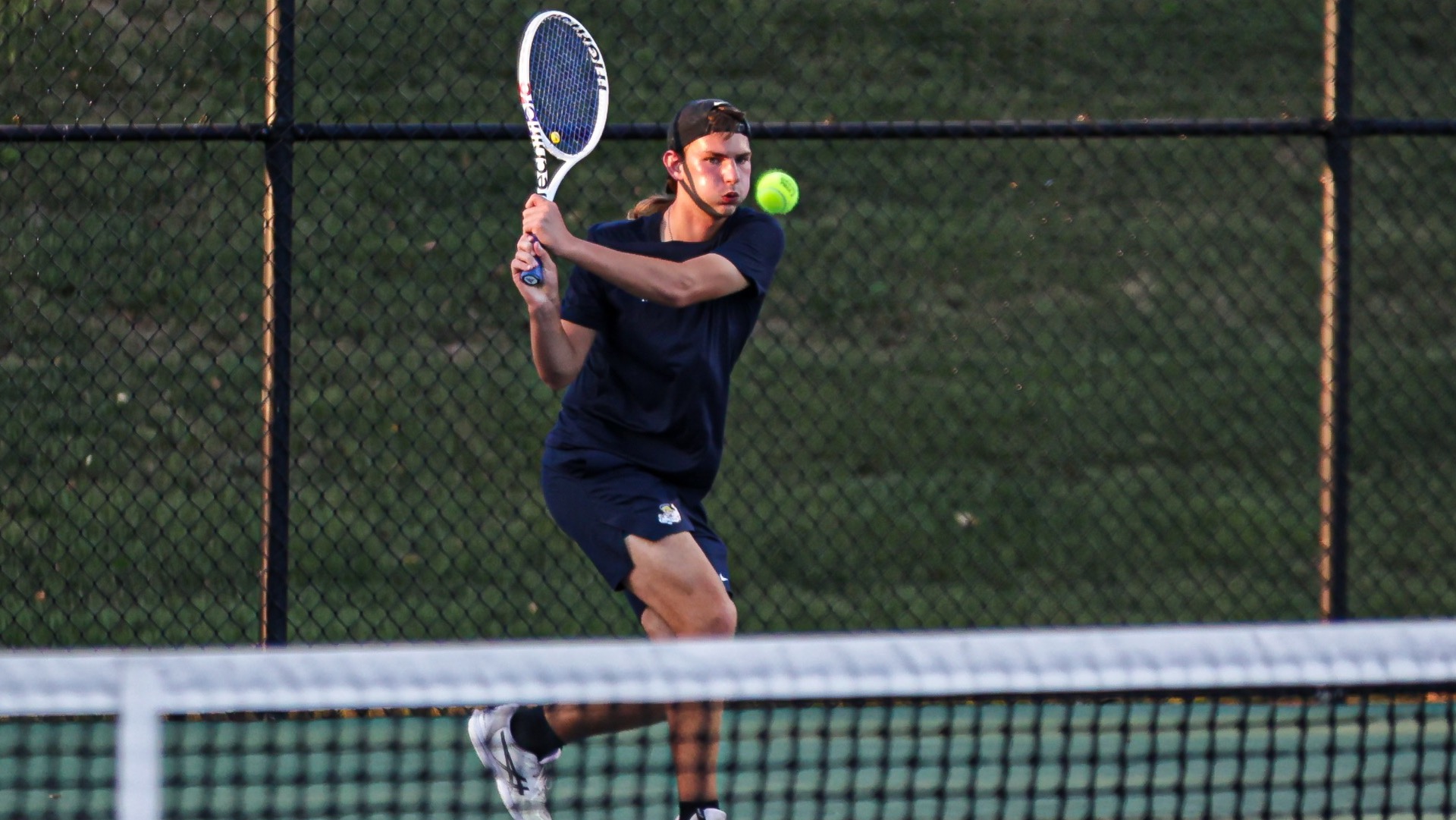 Zach Schrader watches return shot