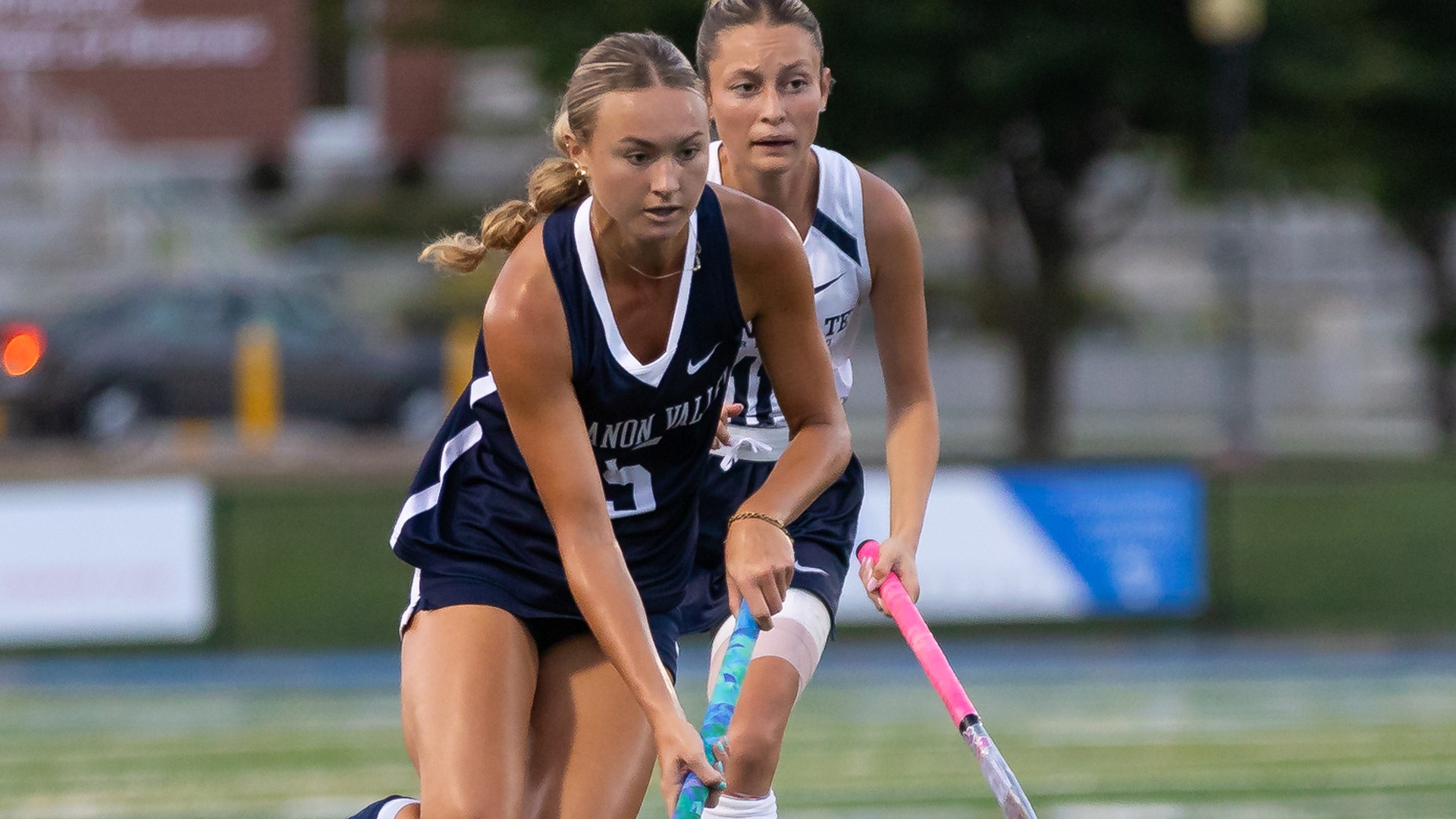 Lauren Foster dribbling ball up the field
