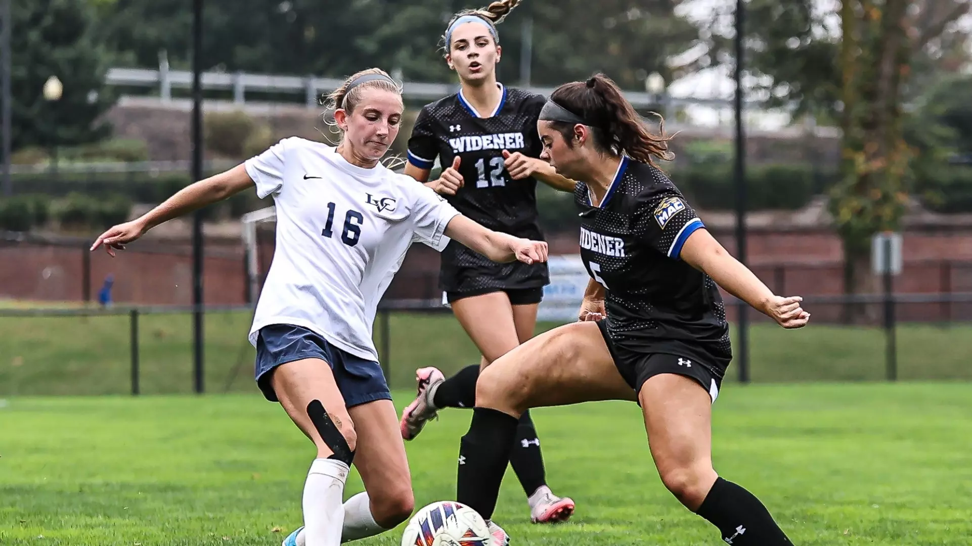 Mikayla Mitchell competes with a defender for the ball