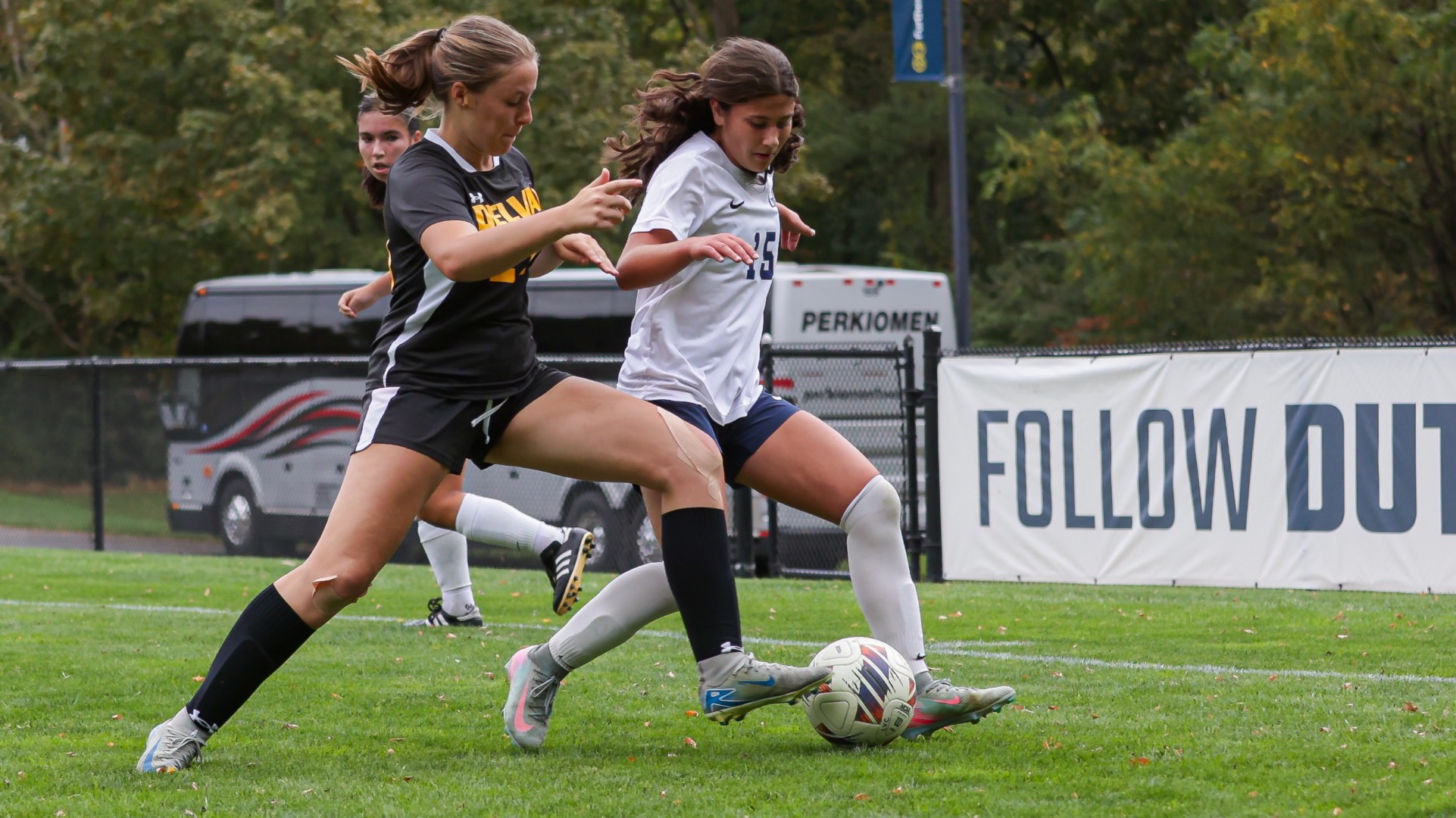 Jayme Beninda competes with a defender for the ball