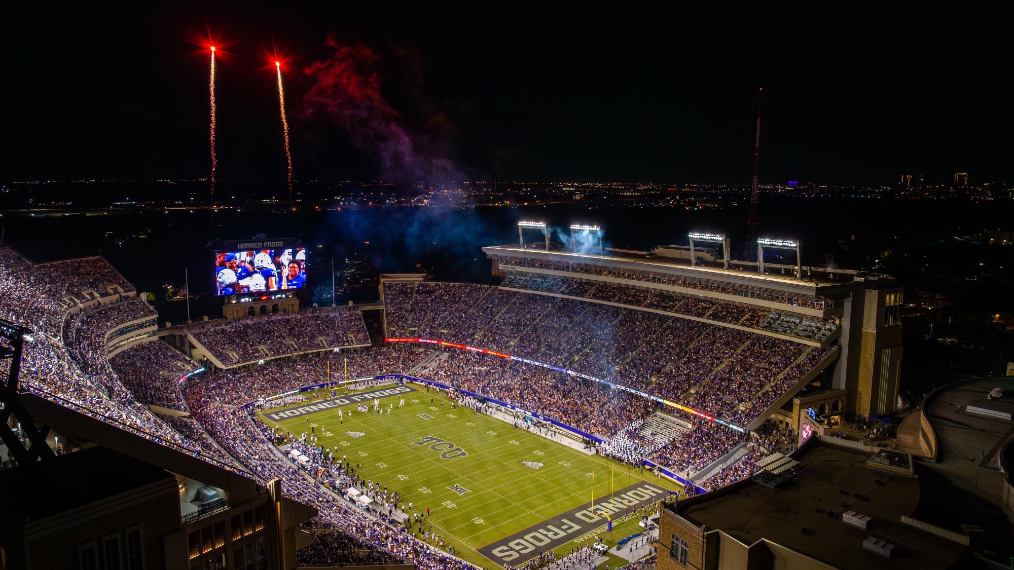 Aerial night view of Amon G. Carter Stadium during a TCU football game