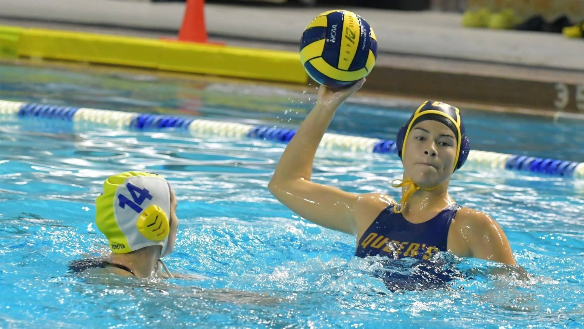 Sami Lee prepares to throw the ball in Water Polo