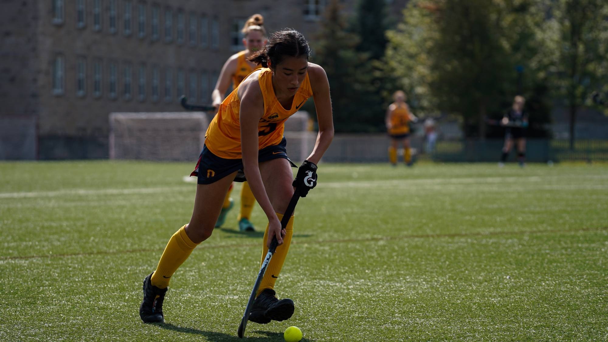 Lauren Breakall carries the ball in Field Hockey