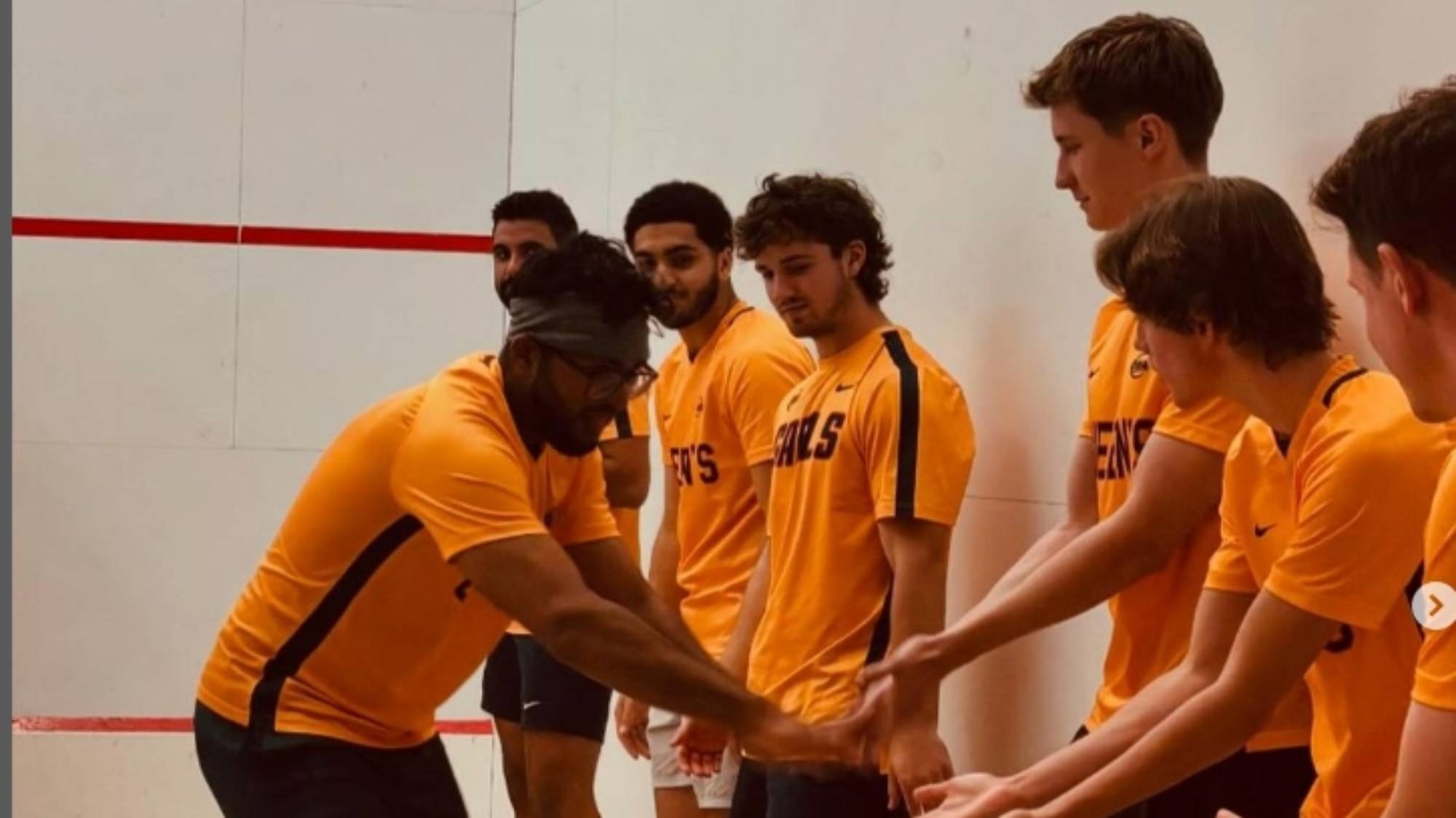 Basit Abdul going down the line of Gaels for the pregame low-fives