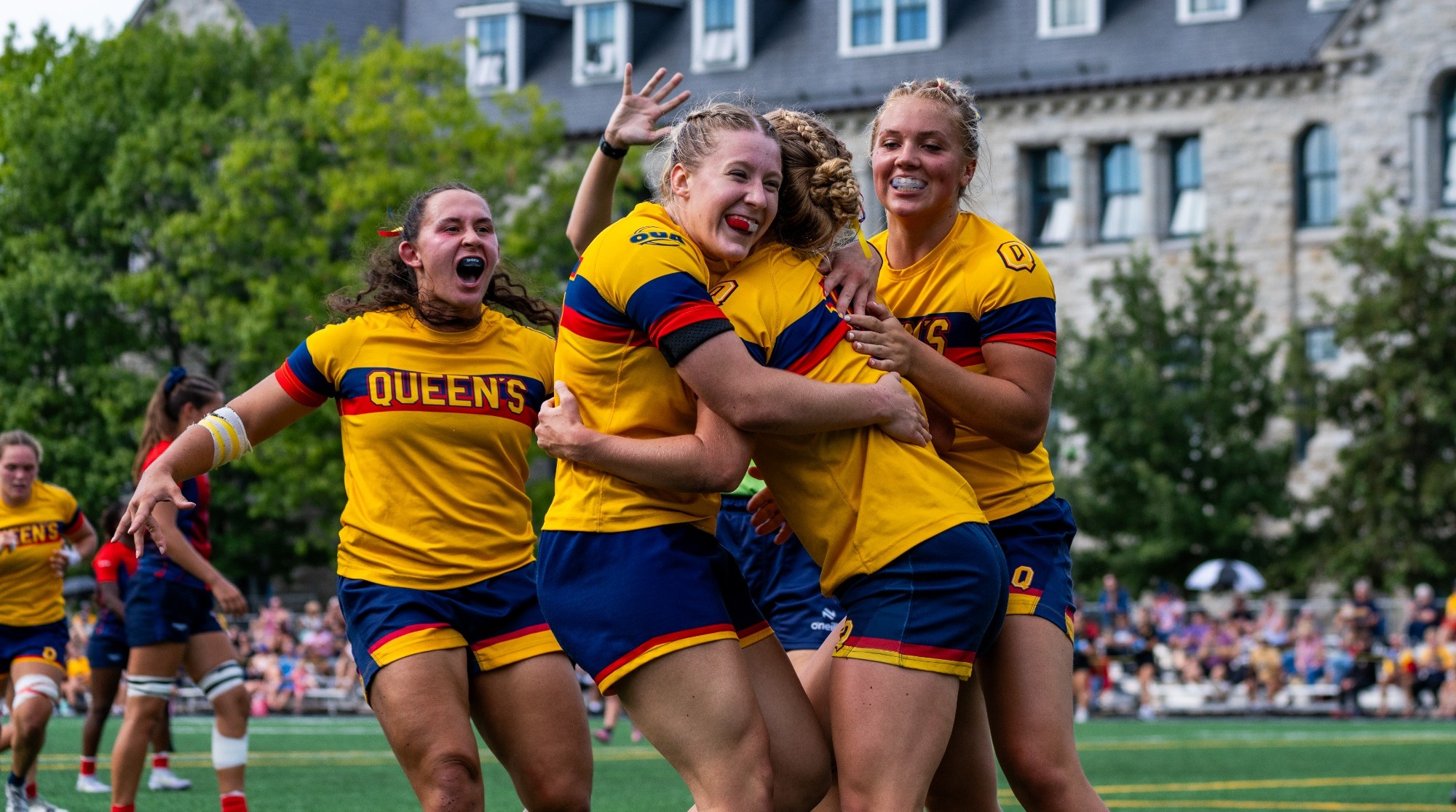 Queen's Women's Rugby players celebrate