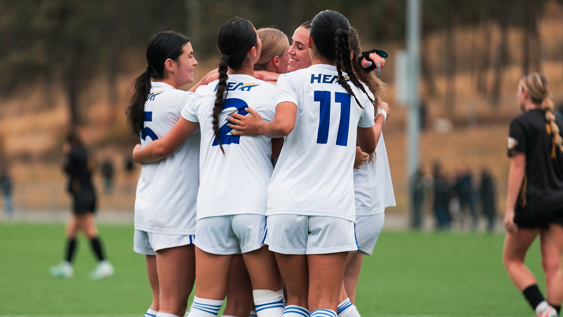 The UBCO Heat celebrate one of their second-half goals during action against the UNBC Timberwolves at Nonis Sports Field.