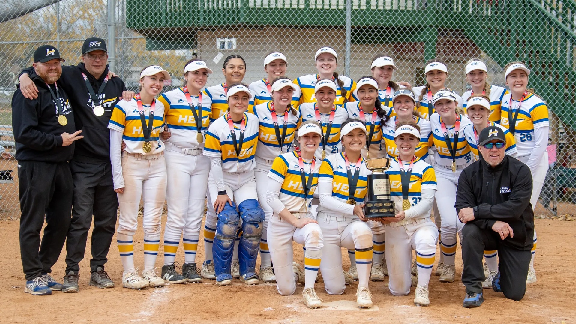 The UBCO Heat softball team poses with the CCSA Championship trophy following their 8-1 win over the Calgary Dinos at Shouldice Athletic Park.